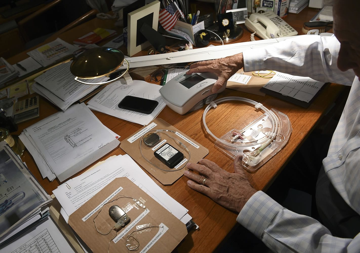 Robert Fischell shows off a few of his medical devices that he has invented. Fischell holds over 200 patents, and has been recognized as the national inventor of the year. Now he's targeting chronic pain. Illustrates PAIN (category a), by Terrence McCoy (c) 2015, The Washington Post. Moved Saturday, August 1, 2015. (MUST CREDIT: Washington Post photo by Toni L.