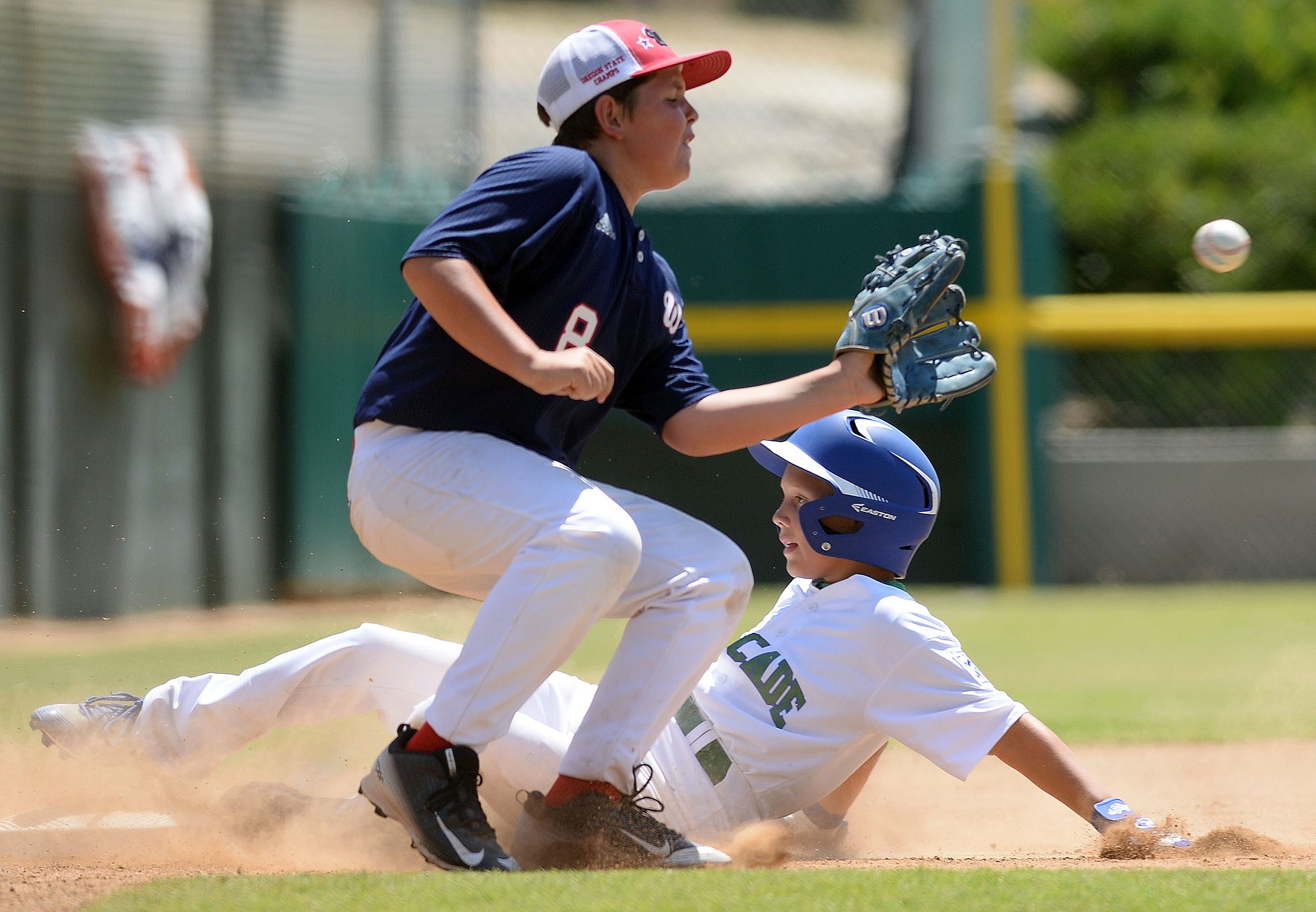 Cascade Little League's Isaac Hodory slides into third base ahead of the tag during the sixth inning of the Northwest Regional semifinal Friday in San Bernardino, Calif. Cascade lost to Wilshire-Riverside of Portland 10-6.