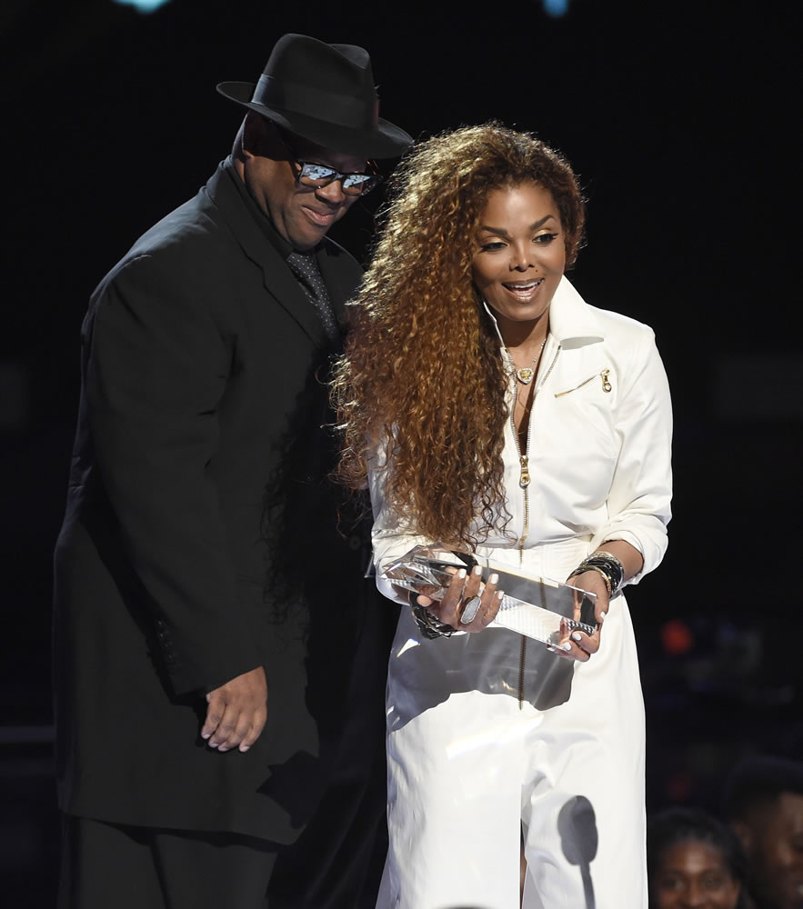 Jimmy Jam, left, presents the Ultimate Icon: Music Dance Visual Award to Janet Jackson on Sunday at the BET Awards at the Microsoft Theater in Los Angeles.