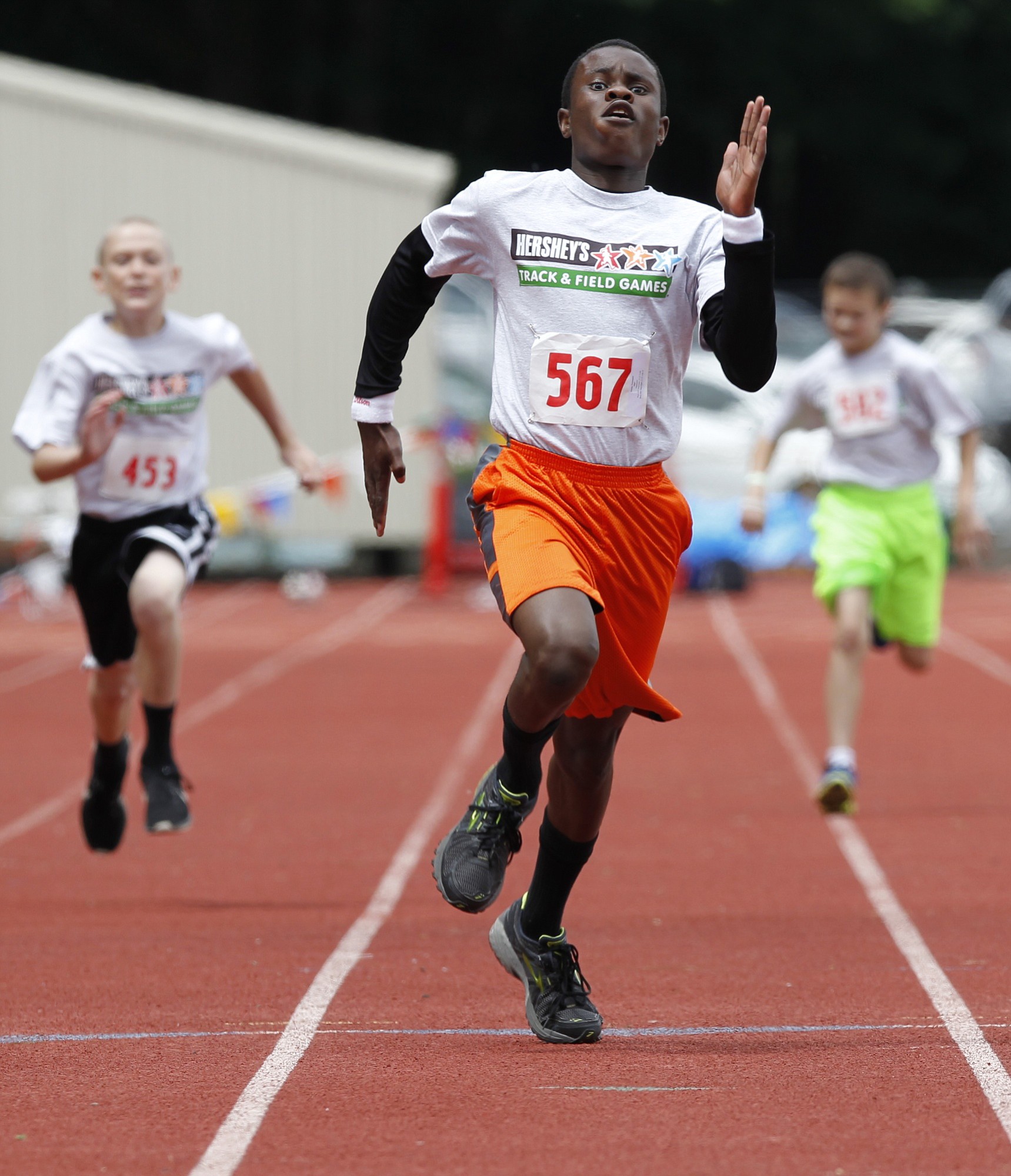 Emmanuel Huang of Vancouver won the 100 meters for boys ages 11-12 in the Hershey's Track and Field Program Washington State Meet held Saturday at McKenzie Stadium in Vancouver.