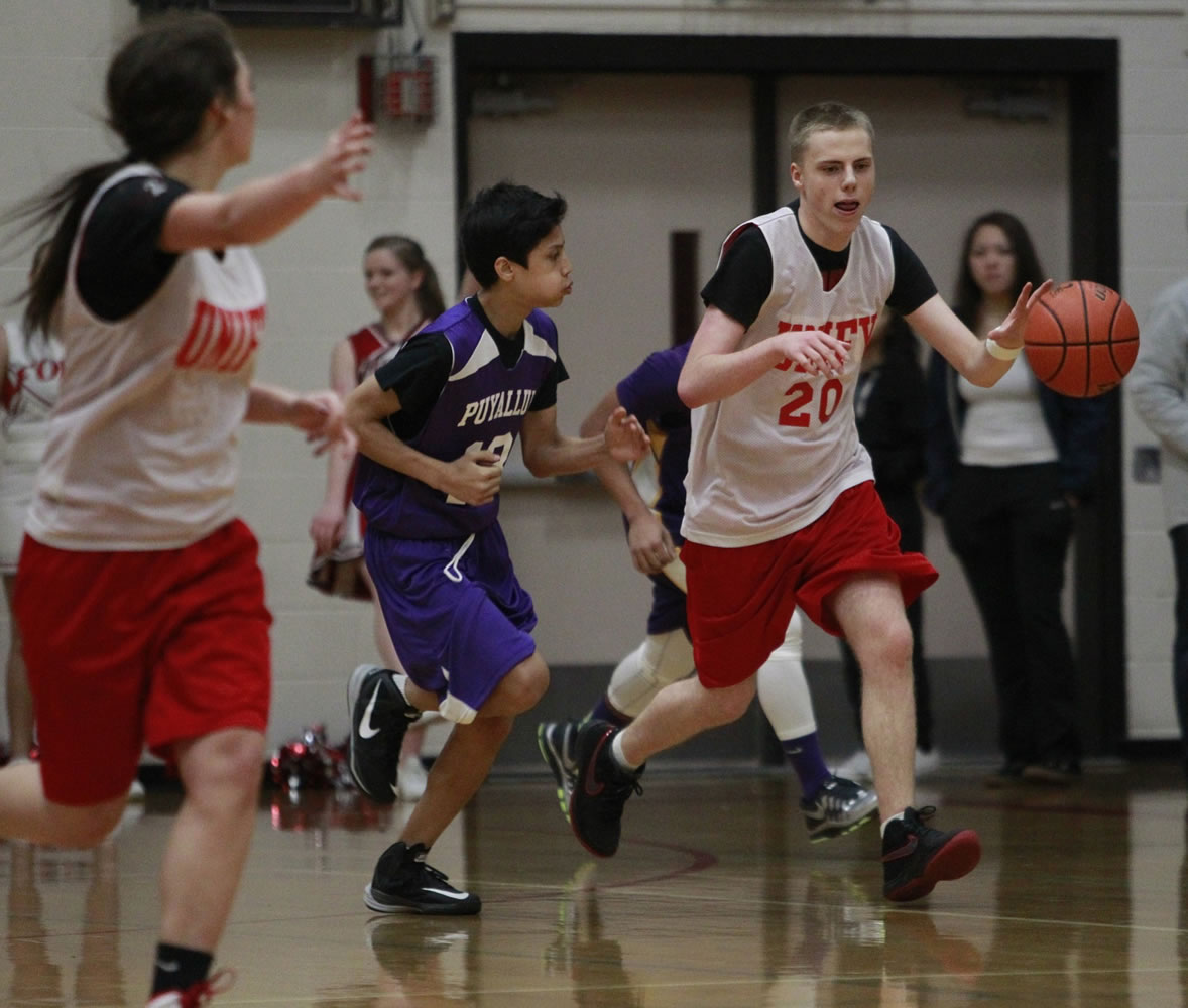 Daniel Barich, No. 20, starts a fast break for Fort Vancouver Unified.