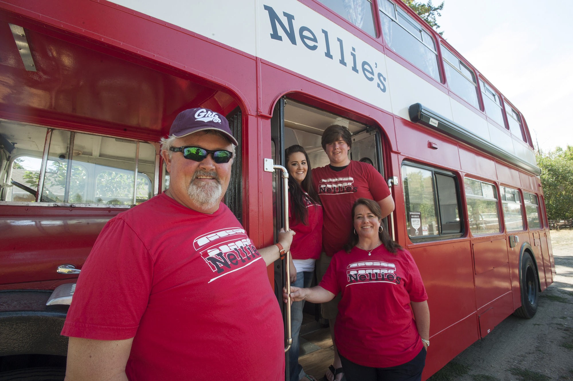 David Sale, left, and his daughter, Kayla; son, Joshua; and wife, Jeannette, restored a double-decker bus and transformed it into a food cart.