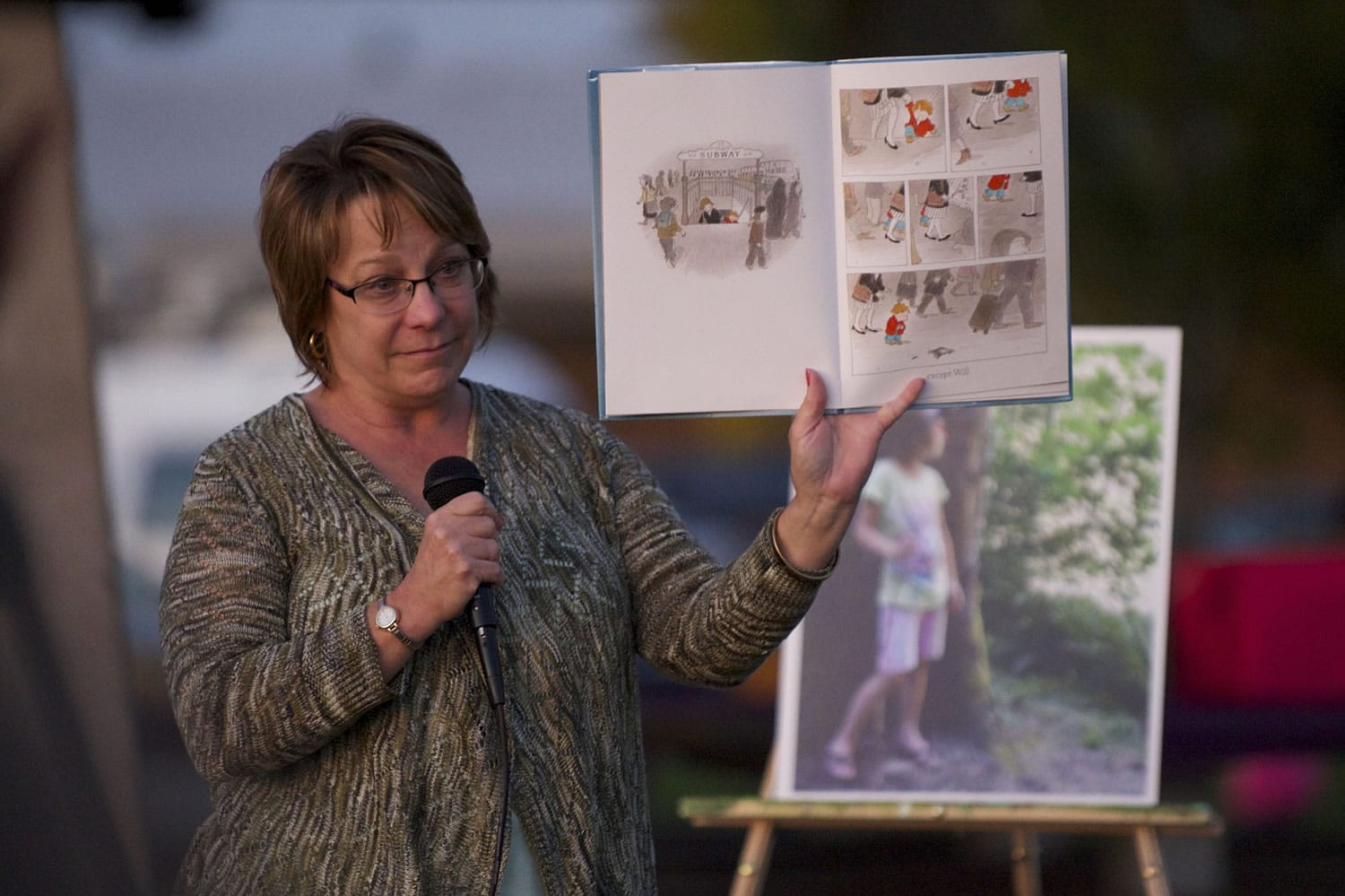 Second grade teacher Cindy Bonnell reads from the book &quot;How to Heal a Broken Wing&quot; by Bob Graham on Wednesday evening during a vigil remembering 7-year-old Stormy Solis.
