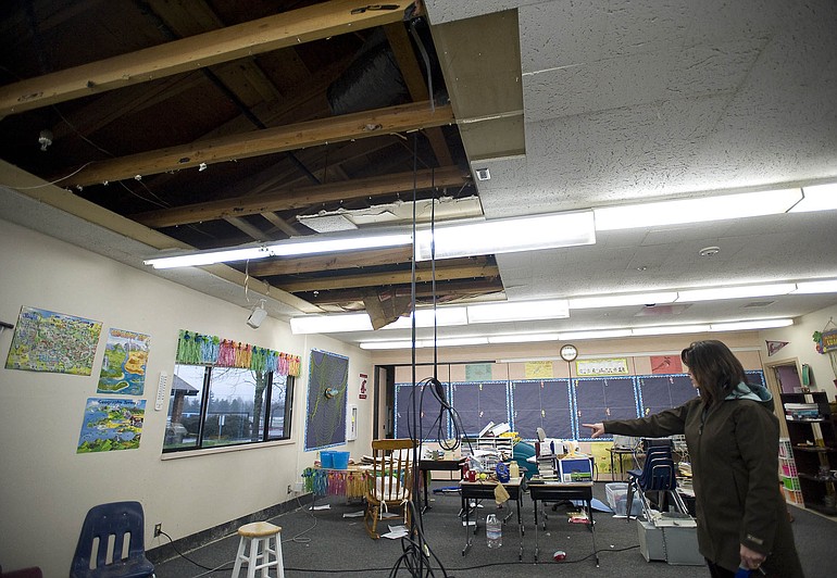 Lisa Swindell, principal at Hockinson Heights Intermediate School, shows one of three fourth grade classrooms that sustained damage on Monday after a fire sprinkler pipe burst when below freezing temperatures hit the area on Saturday.