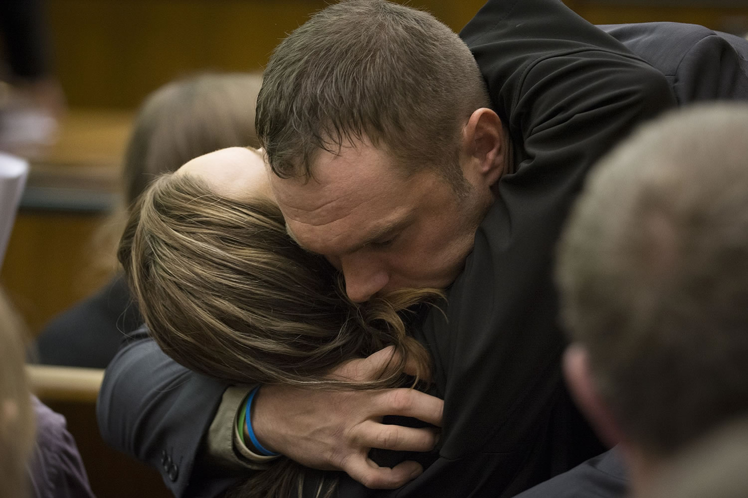 Photos by Ariane Kunze/The Columbian
Darrell Christopher Fry embraces friends and family after pleading guilty to manslaughter Thursday in connection to the shooting death of Matthew Clark in October 2012.