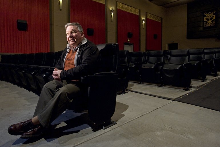 Alexander MacKenzie, director of &quot;Dancing on the Edge,&quot; takes a seat at the Kiggins Theater, where his film will show for a weeklong run starting Friday.