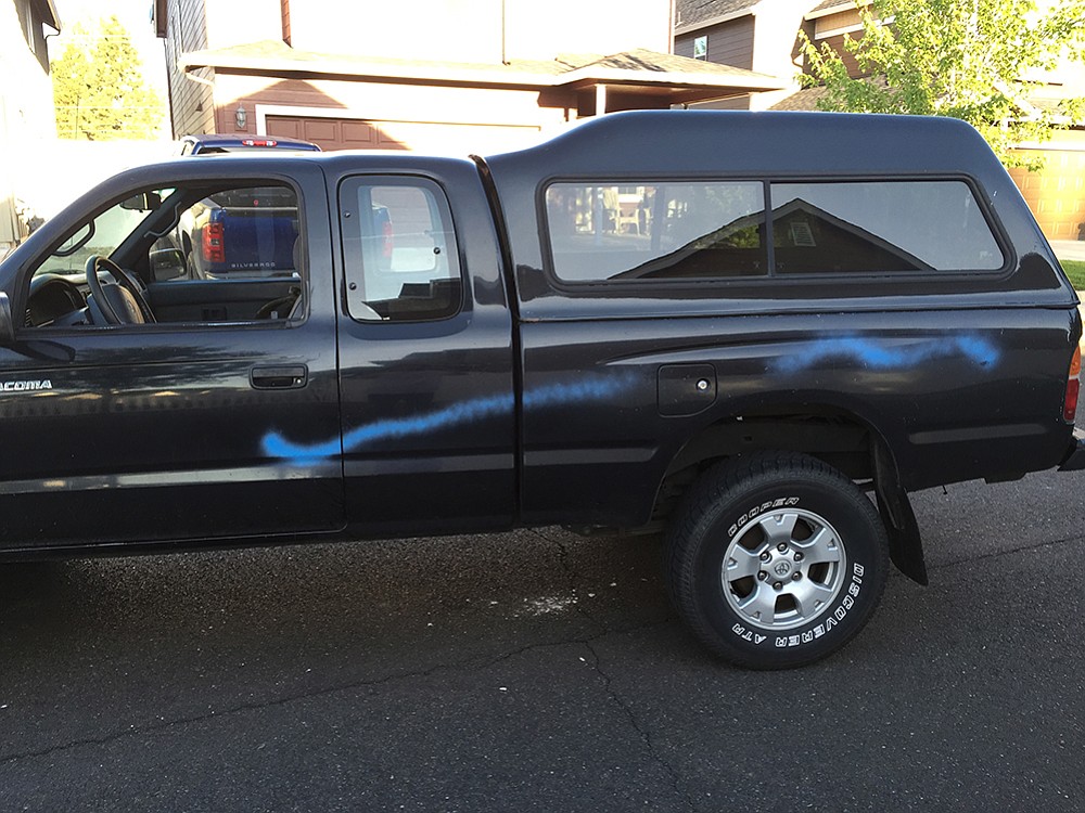 This pickup was one of two dozen vehicles, homes and other property damaged Saturday by paint-wielding vandals in Battle Ground Village.