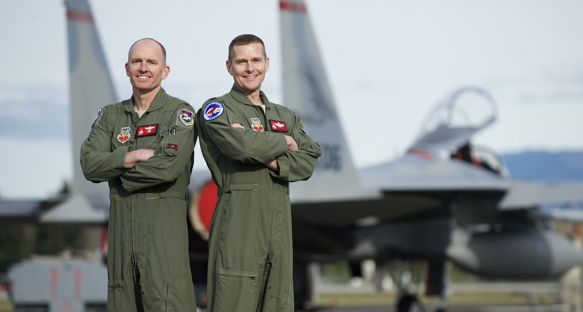 Col. Paul Fitzgerald, left, of Hockinson, is the new commander of the 142nd Fighter Wing at Portland Air National Guard Base after the retirement of Vancouver pilot Col.