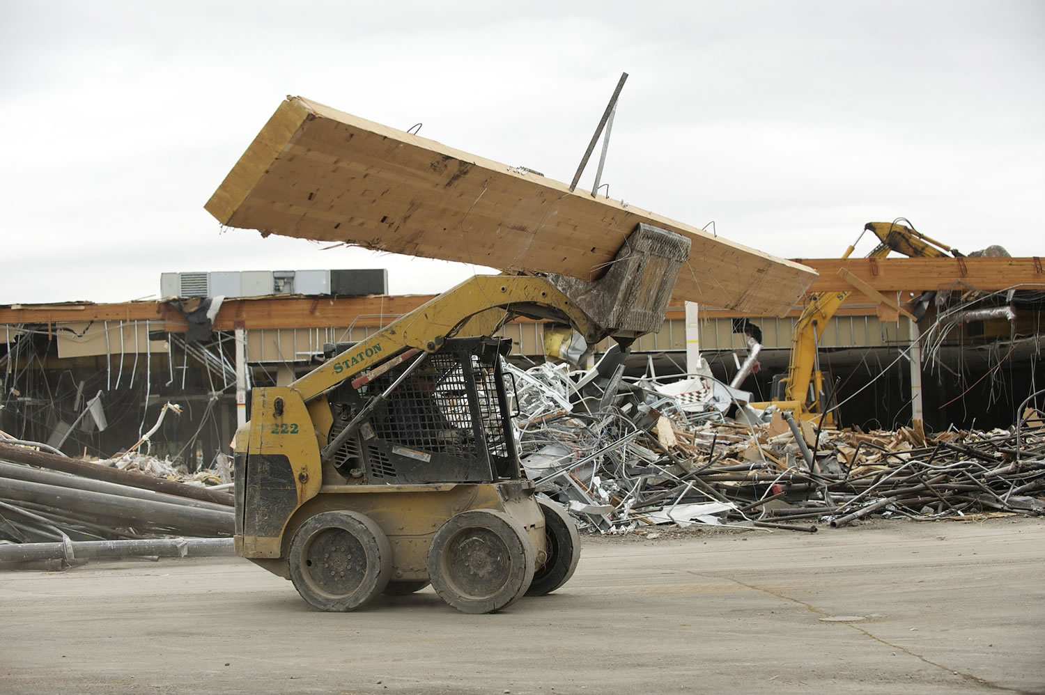 Crews from Staton Co. work to demolish the old Fred Meyer store at Grand and Fourth Plain boulevards to make way for a proposed grocery store that has not been identified so far. Fred Meyer vacated the store in 2008.