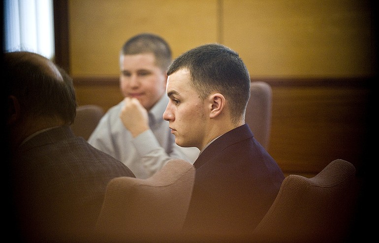 Daylan Berg, foreground right, and Jeffery Reed, background, shown in court May 18, are accused of shooting a VPD sergeant during a home invasion robbery.