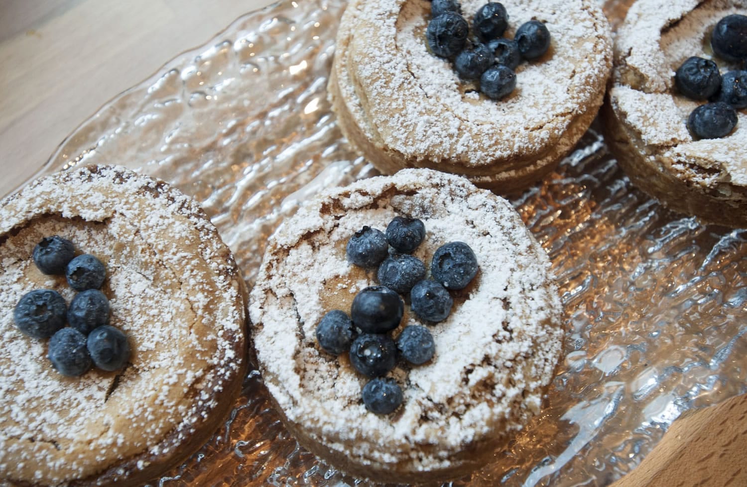 A brown butter tart with blueberries is served at the Bleu Door Bakery.