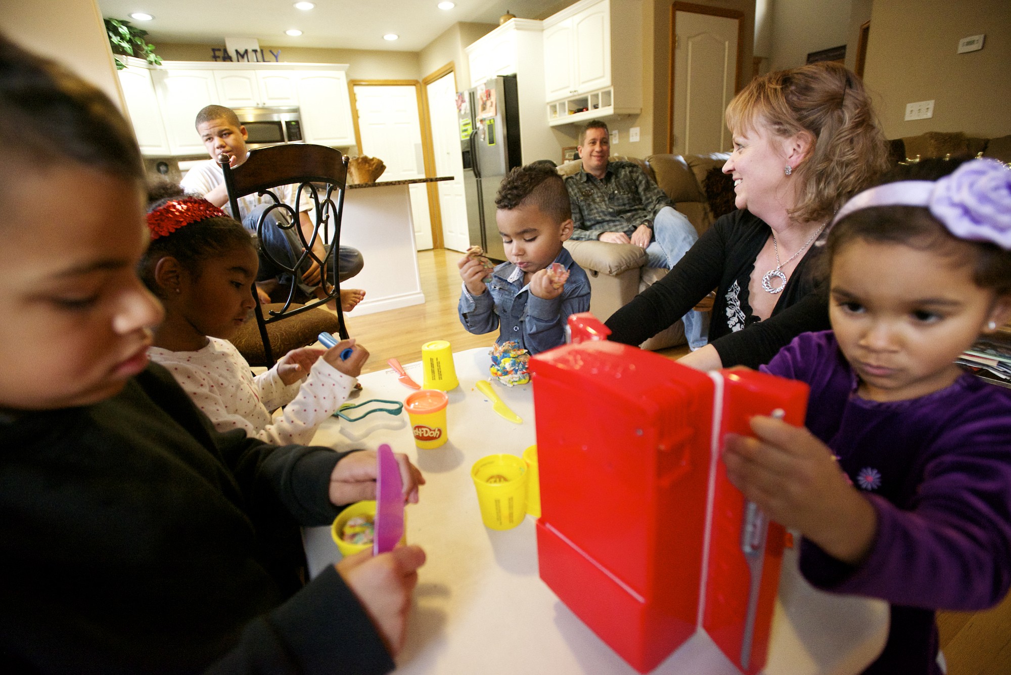 Gary and Michelle Fowler spend time with their five adopted children, from left, Jeramiah, 8; Cortana, 5; Daniel, 15; Elijah, 3; and Kara, 4. &quot;For a whole year we didn't get any sleep,&quot; Gary Fowler said.