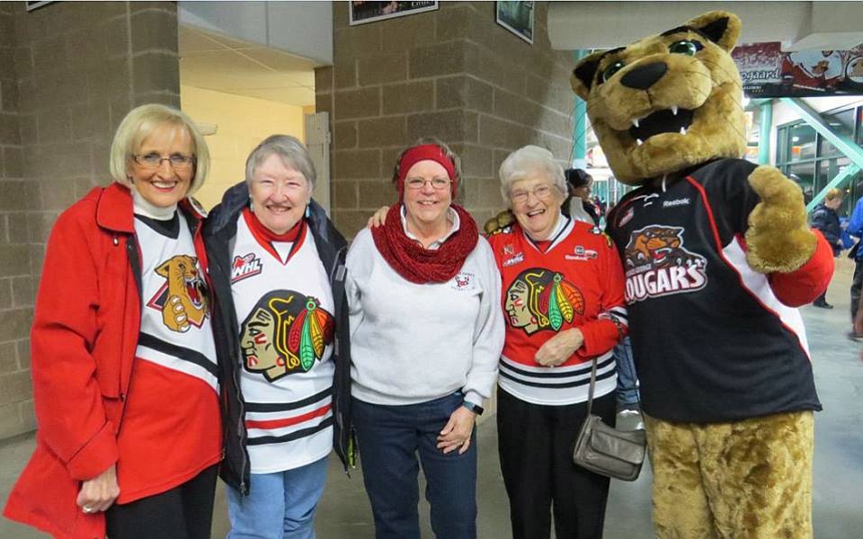 From left, a Prince George fan, Peggy Dale of Vancouver, Wash., Linda Barbee, Ardyce Moore and Cougars mascot Rowdy Cat.