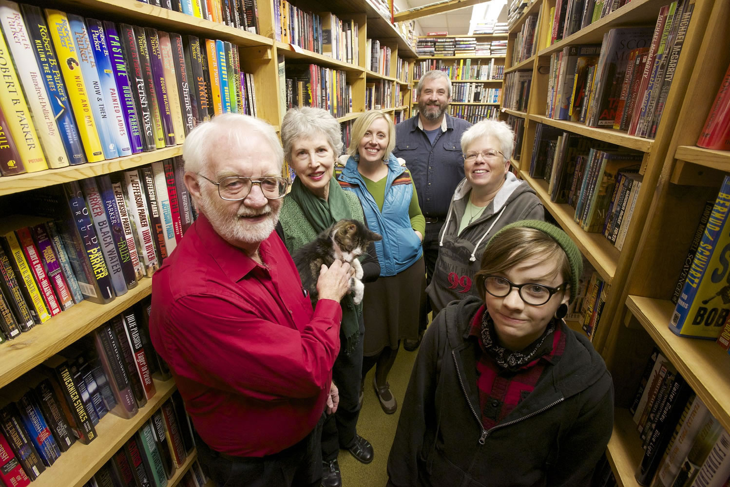 Vintage Books store owners Alec Milner, from left, and Becky Milner -- with Henry the cat -- along with guest author Kate Dyer-Seeley and employees Chris Milner, Pepper Parker and Finch Alder Hogue.