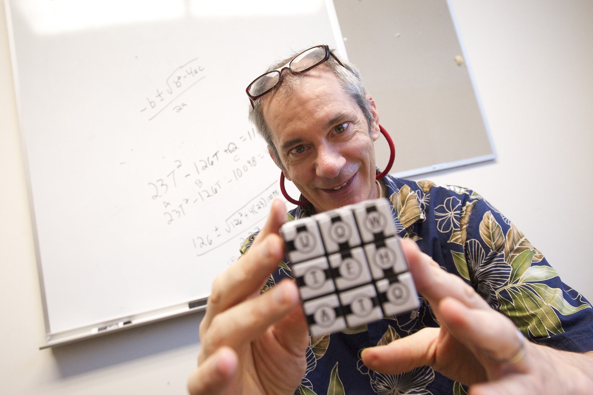 Thomas Gazzola holds a modified Rubik's cube his team decoded on their way to winning the Massachusetts Institute of Technology's Mystery Hunt 2015, considered to be one of the toughest challenges of its kind in the world.