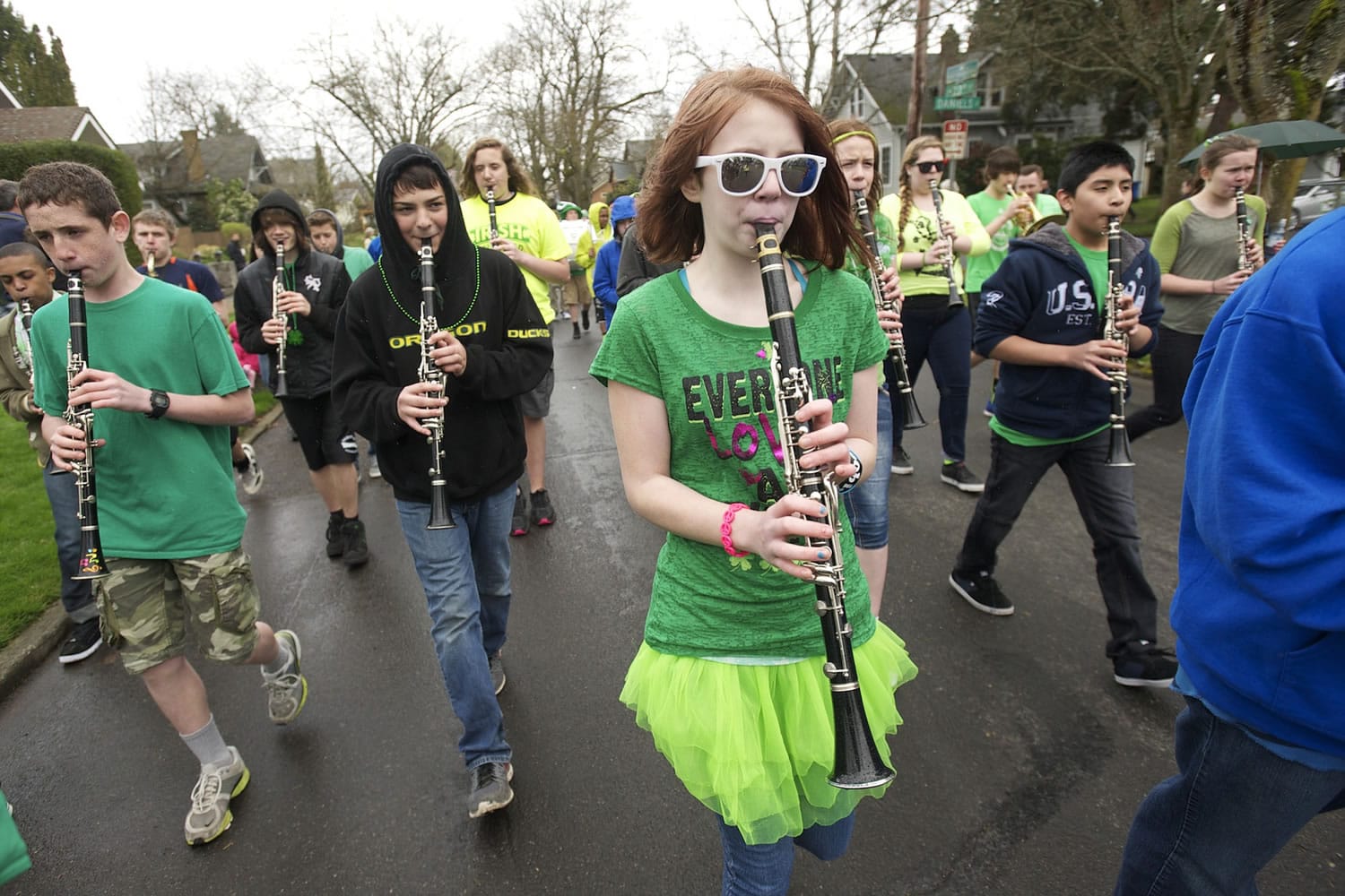Emily Kennedy, 12, plays clarinet with the Discovery Middle School marching band in the 23rd annual Paddy Hough Parade as it makes its way through downtown Vancouver, Monday, March 17, 2014.