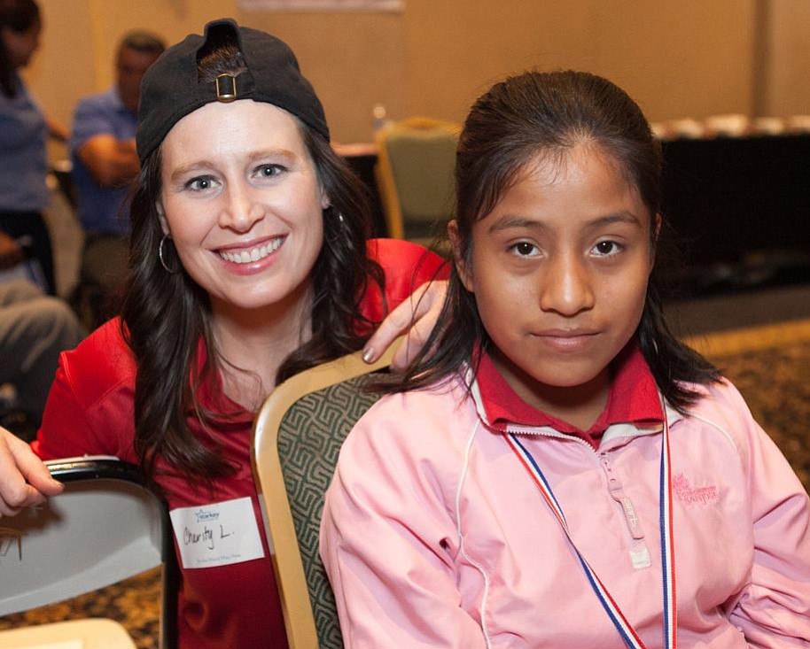 Fircrest: Charity Leitz, left, was one of five Audigy Group employees who traveled in late January to Cabo San Lucas, Mexico, to fit local people -- such as this 12-year-old girl -- with hearing aids.