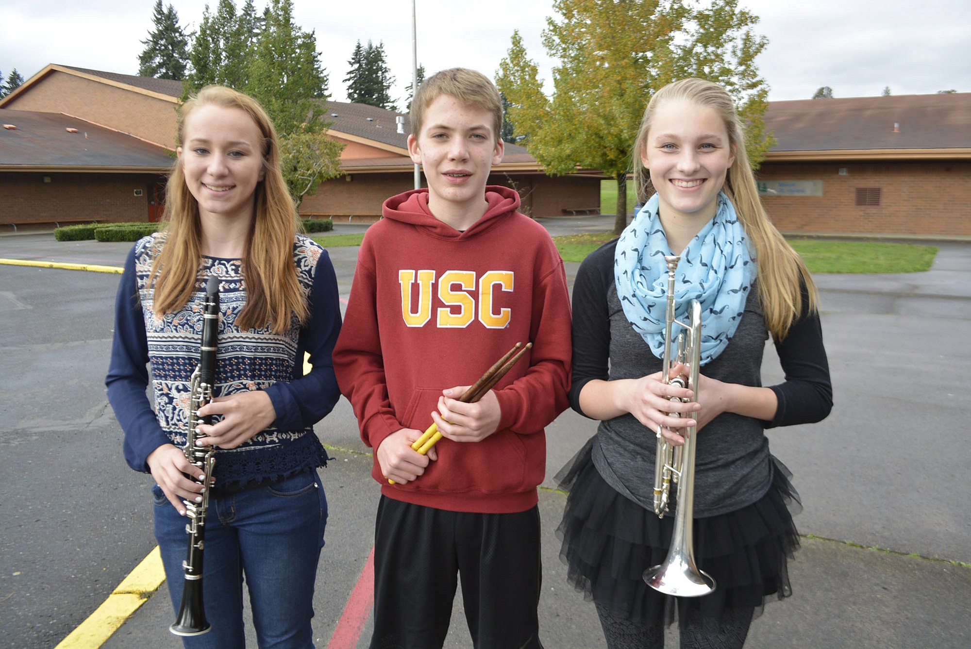 Washougal: Jemtegaard Middle School students Clara Harris, from left, Ian Palmer and Emily Johnson were selected to play in the Clark County Honor Band. They'll join other students on stage for a concert on Feb.