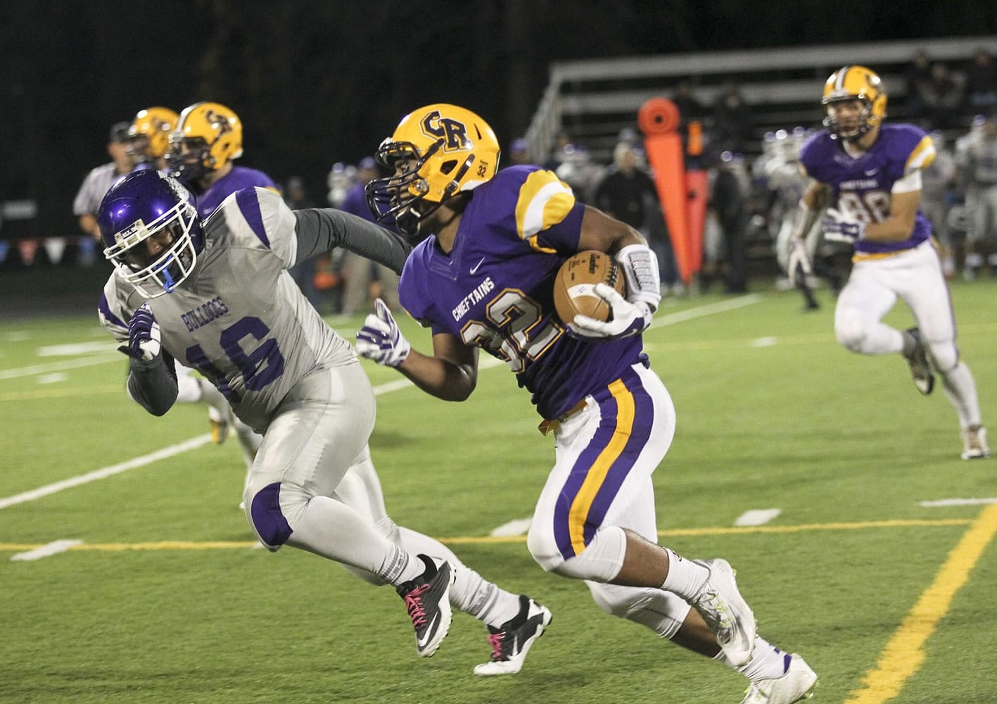 Columbia River's Nathan Hawthorne turns upfield on a pass reception against Garfield on Saturday at Kiggins Bowl.