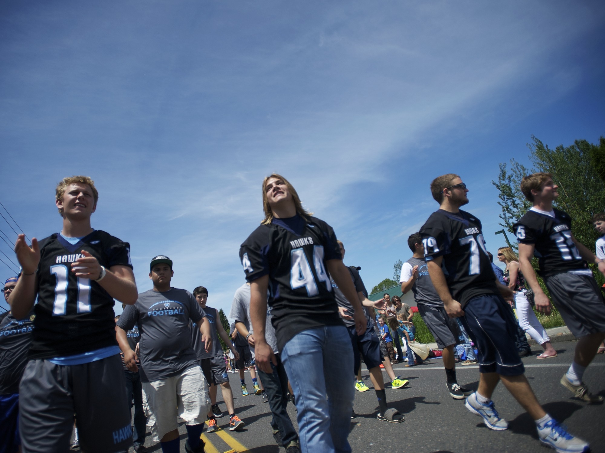 Members of the Hockinson High School football team march in the Hockinson Fun Days Parade to promote their upcoming season on Friday May 31, 2013.
