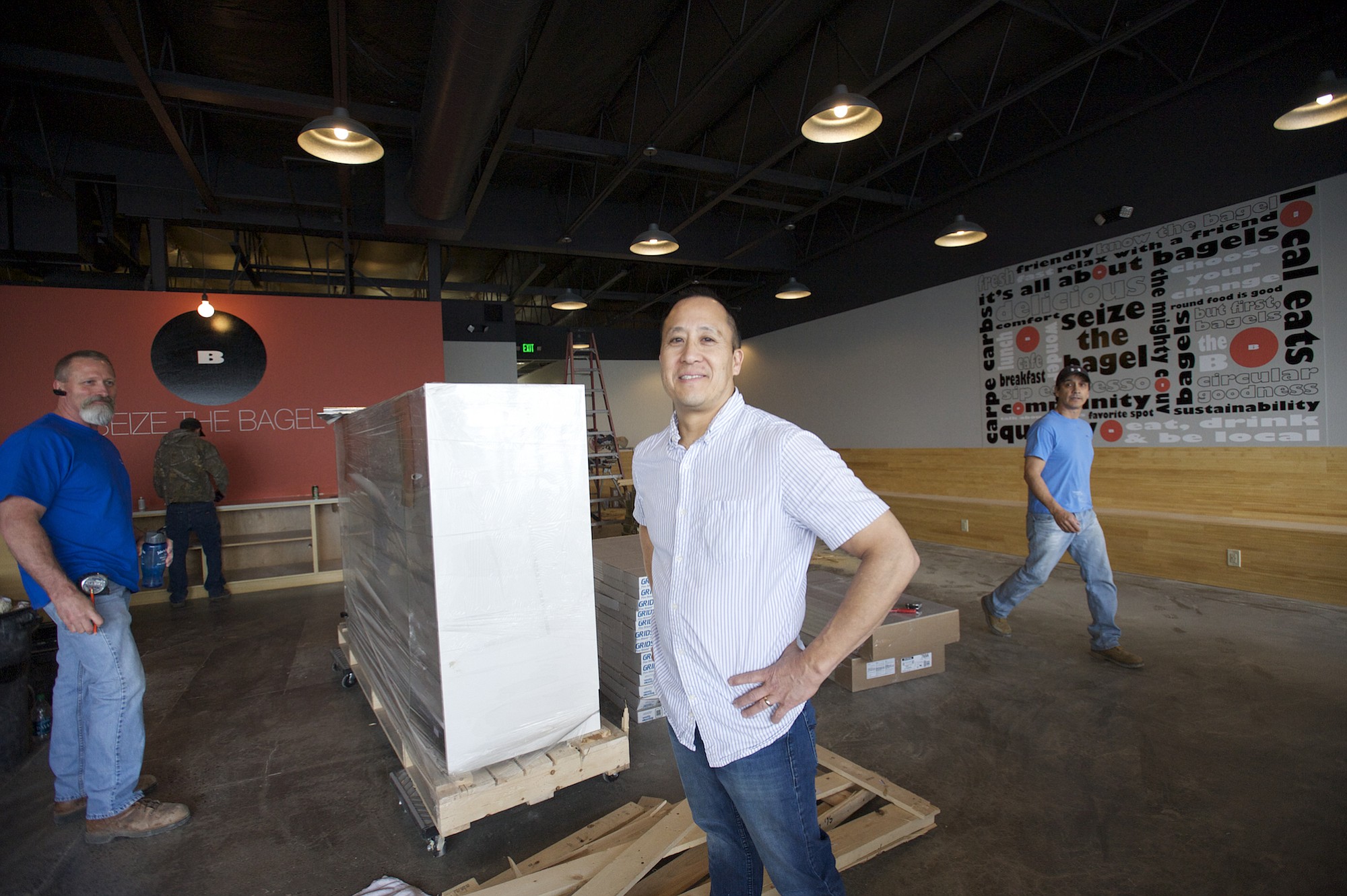 Seize the Bagel co-owner Bruce Yamamura prepares for the April opening of his restaurant's new location at 13215 S.E. Mill Plain Blvd., Suite C3. &quot;It is us,&quot; said co-owner Cindy Yamamura.