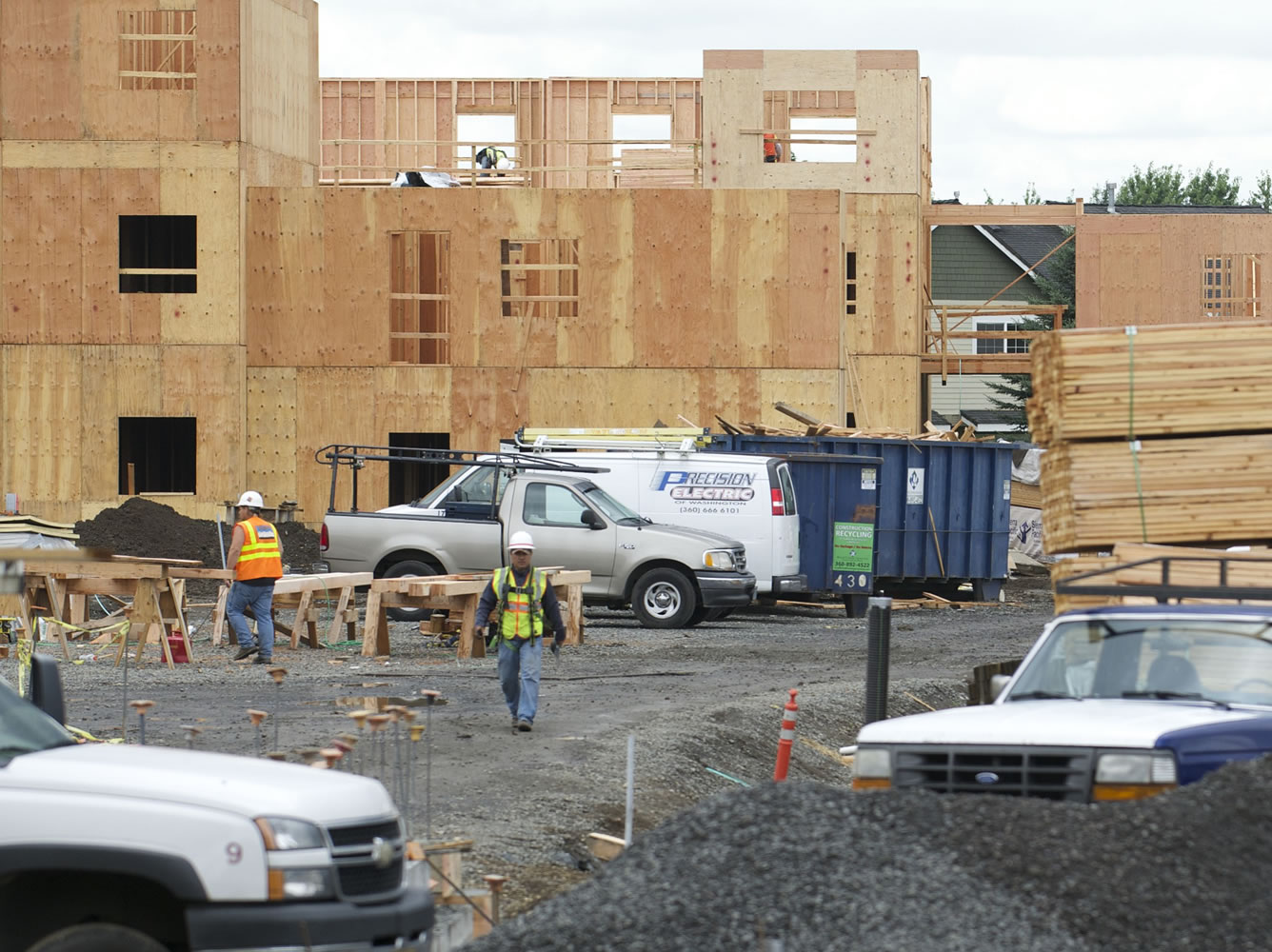 Crews work in August 2015 to build an apartment complex to serve low-income residents on Southeast First Street, east of 164th Avenue.
