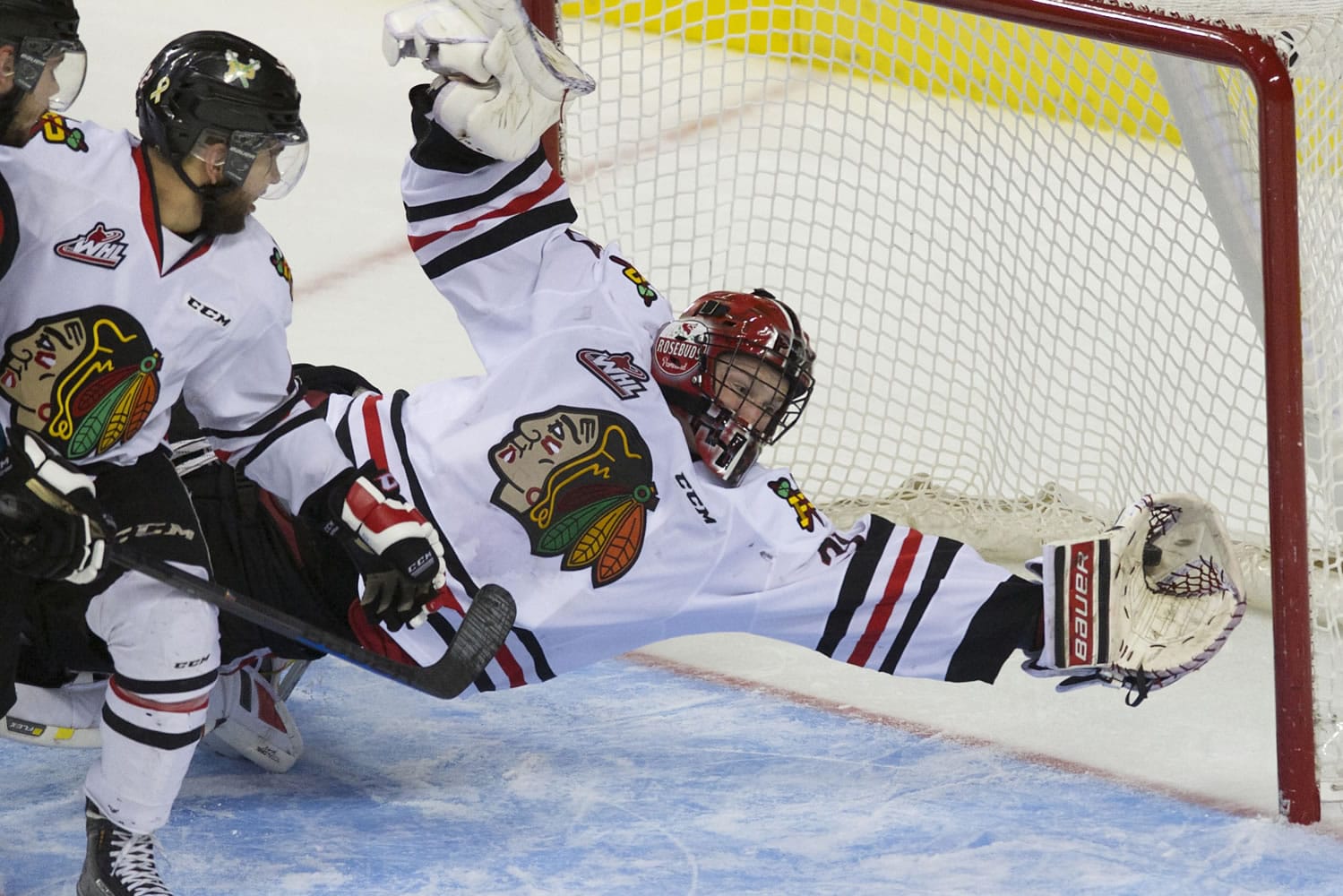 Portland goaltender Adin Hill makes a save that is later ruled a goal as the Portland Winterhawks take on the Kelowna Rockets at the Moda Center, Tuesday, April 28, 2015.