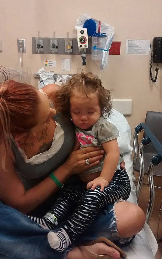 Courtesy of Teresa Weese
Teresa Weese comforts her 21-month-old daughter, Madastee, in the emergency room after a coughing spell. Madastee was up-to-date on her vaccines, but still contracted whooping cough.
