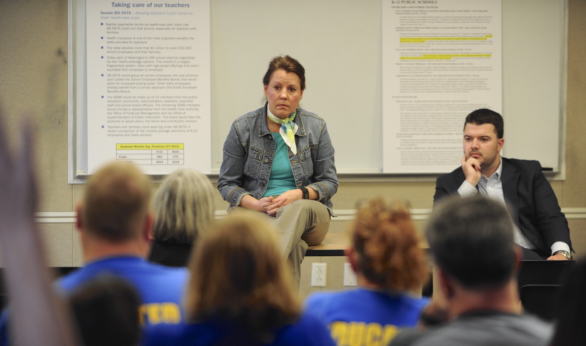 Sen. Ann Rivers, center, and Rep. Brandon Vick talk with teachers about funding K-12 education at the Camas Public Library on Saturday.