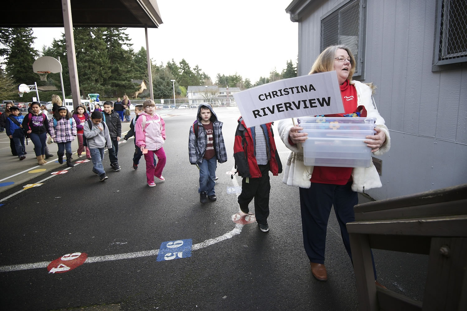 Audrey Christina, a third grade teacher for Crestline Elementary School, right, leads her third grade class to a portable classroom at Riverview Elementary on Thursday.
