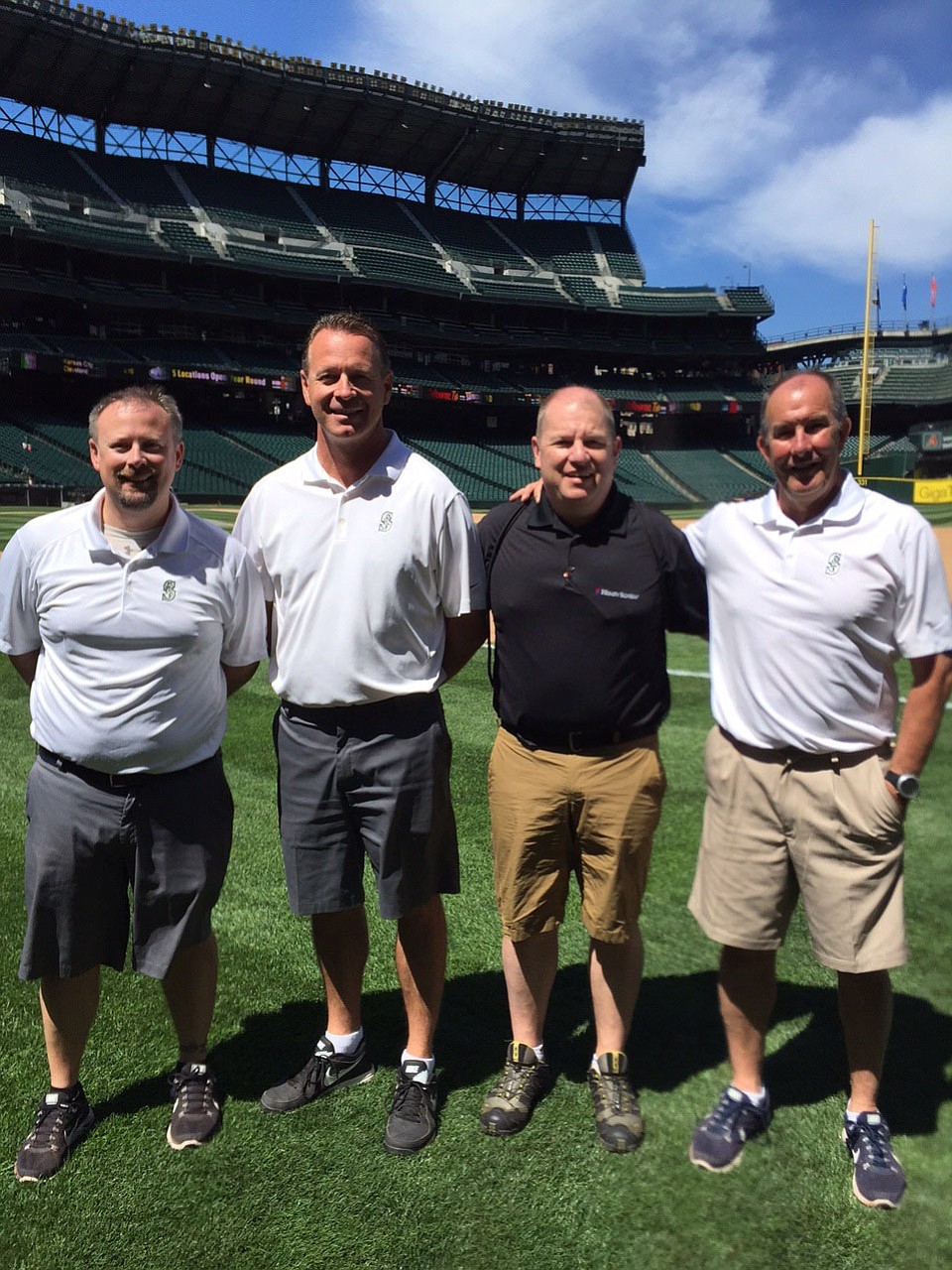 East Vancouver: Brian Apling, black shirt, joined trainers from the Seattle Mariners at Safeco Field on July 28 to talk to children as part of Professional Baseball Athletic Trainers Society's PLAY Campaign.