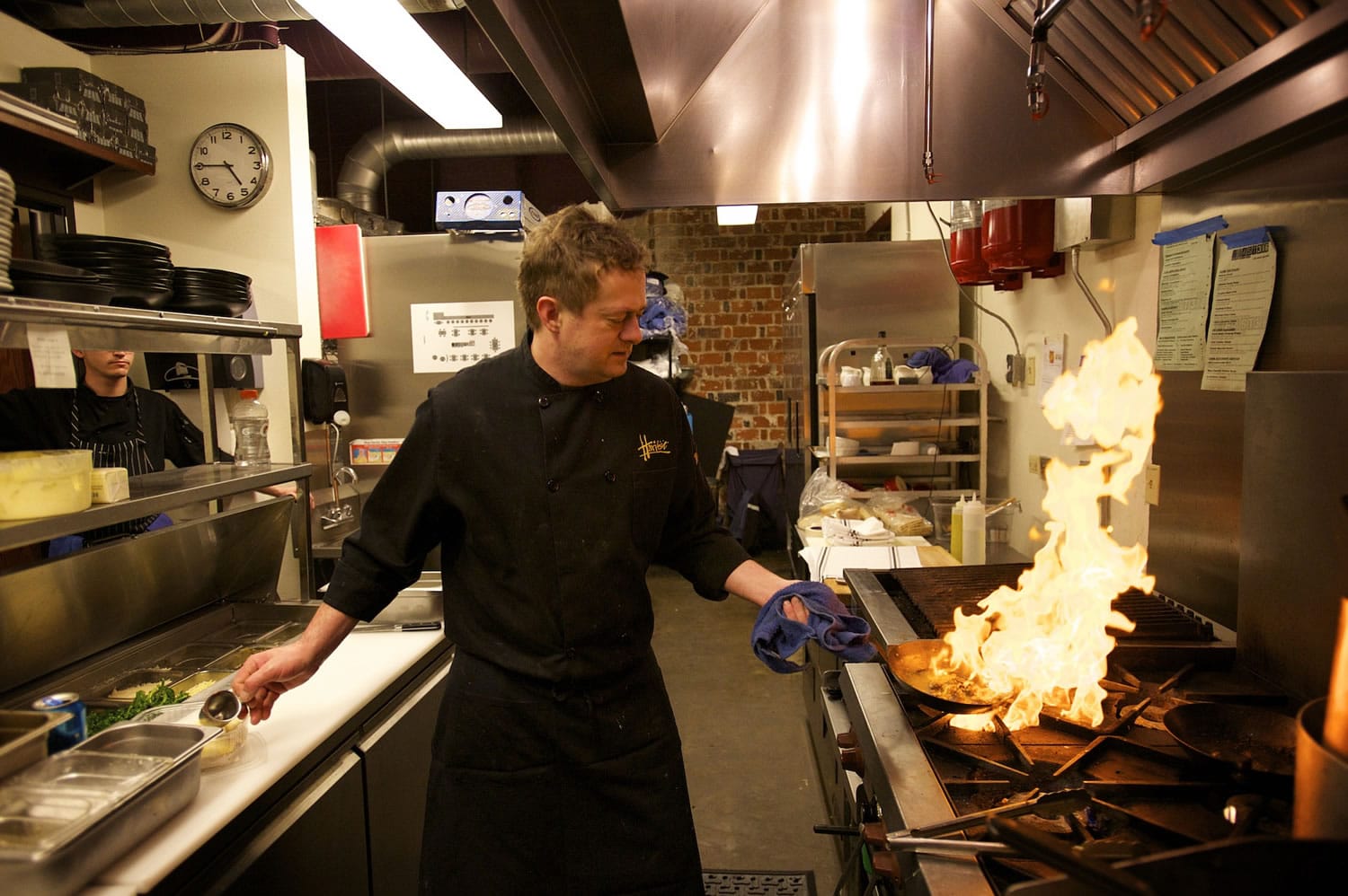 Chef Tim McCusker prepares a dish at his new restaurant, Feast at 316, in downtown Camas.