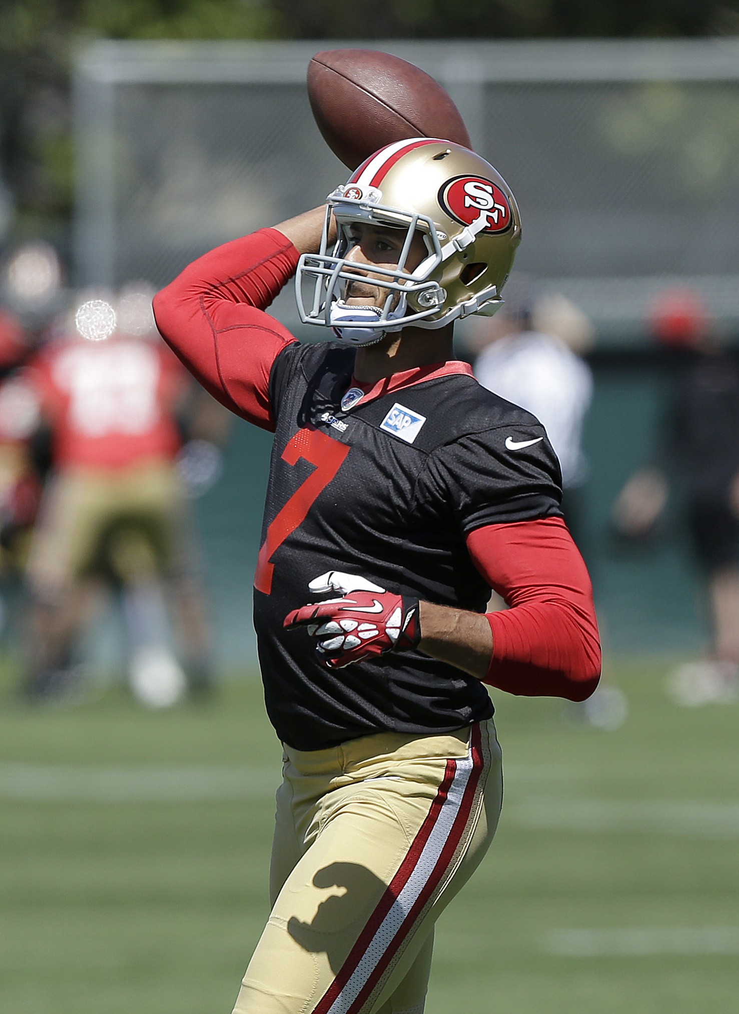 San Francisco 49ers quarterback Colin Kaepernick (7) passes during a June minicamp in Santa Clara, Calif.