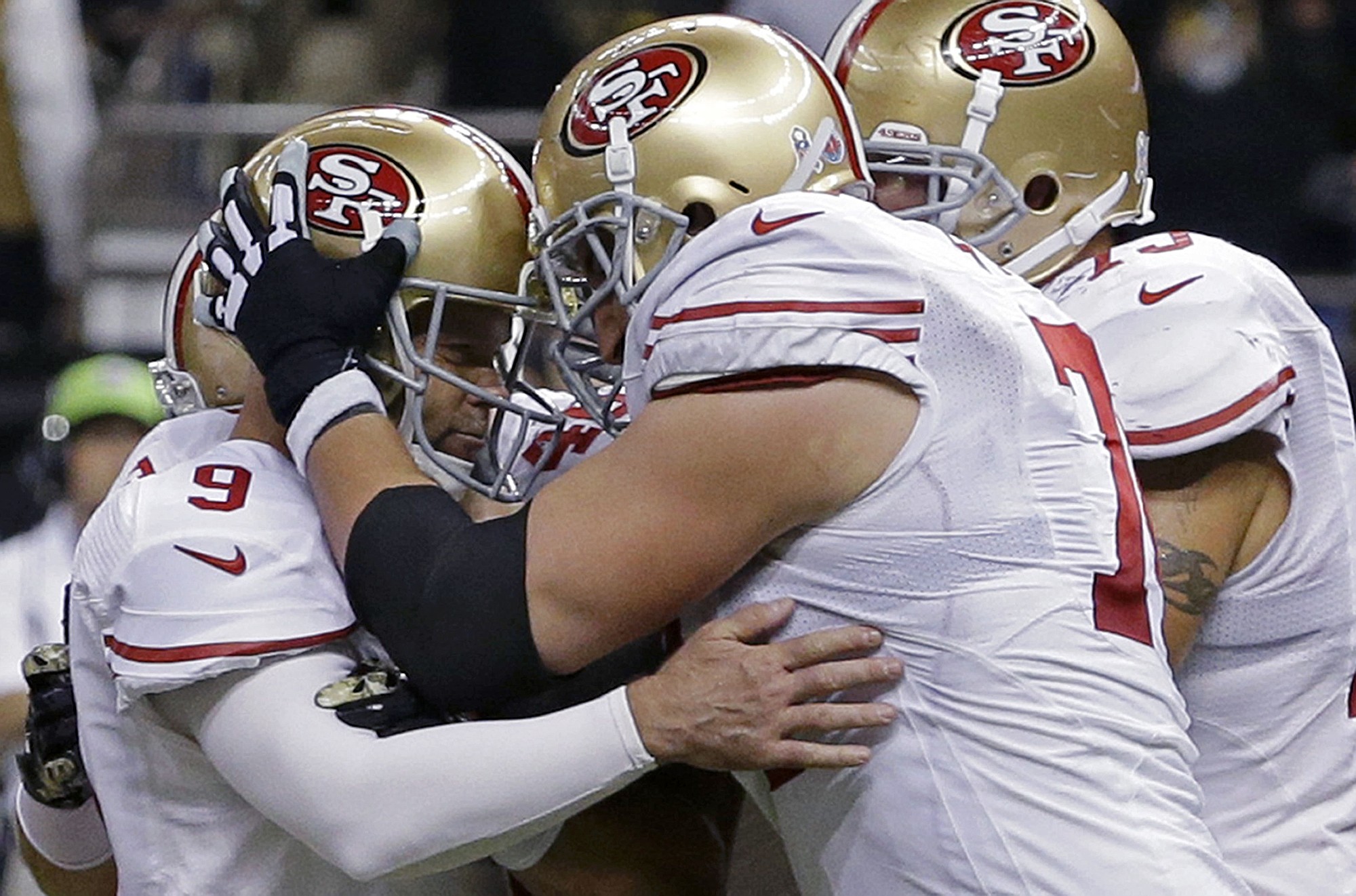 San Francisco 49ers kicker Phil Dawson (9) is congratulated by tackle Joe Staley (74) after kicking the game-winning field goal in overtime against the New Orleans Saints in New Orleans, Sunday, Nov. 9, 2014. The San Francisco 49ers won 27-24.