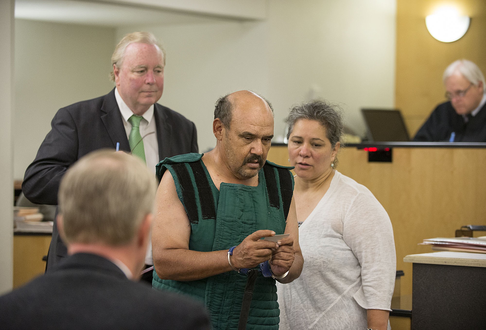 Samuel U. Morales of Woodland, center, makes a first appearance Friday in Clark County Superior Court after allegedly setting fires along Interstate 5 south of Ridgefield on Wednesday.
