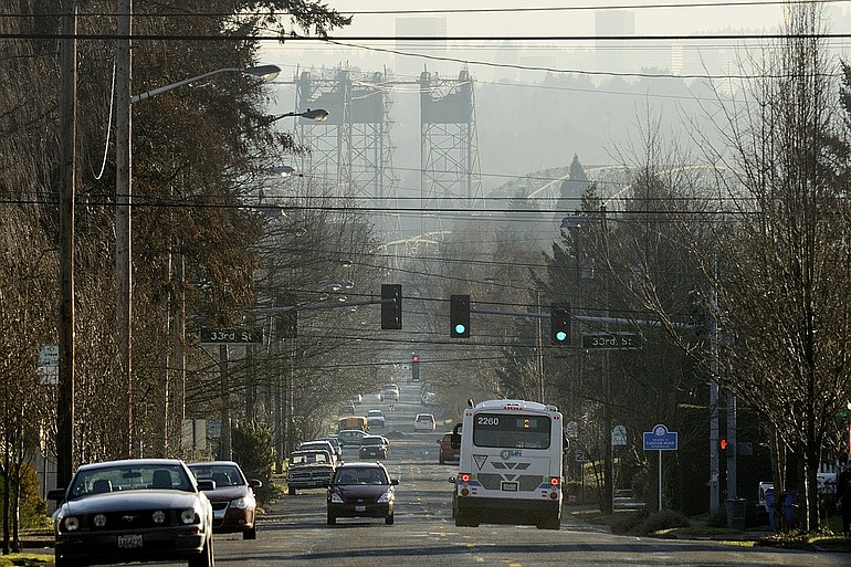 The Interstate Bridge can be seen Monday through a fine layer of haze from Columbia and 37th streets in Vancouver.