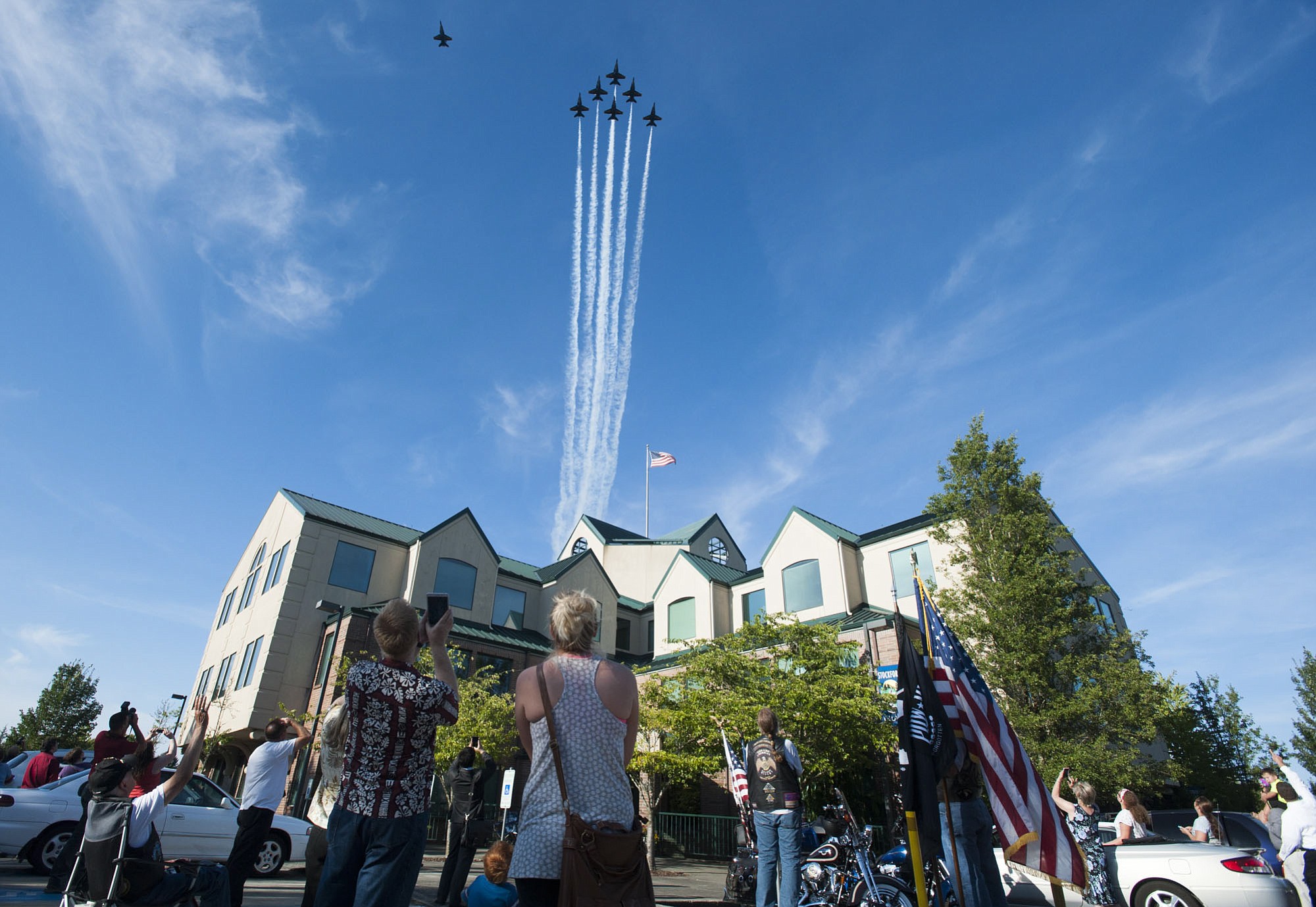 Six F-18 Hornet jet fighters fly Wednesday over the Harley H. Hall Building in Hazel Dell. The Blue Angel flyover was a salute to Harley Hall, a Vancouver aviator who was the Blue Angels' &quot;boss&quot; in 1970-1971.
