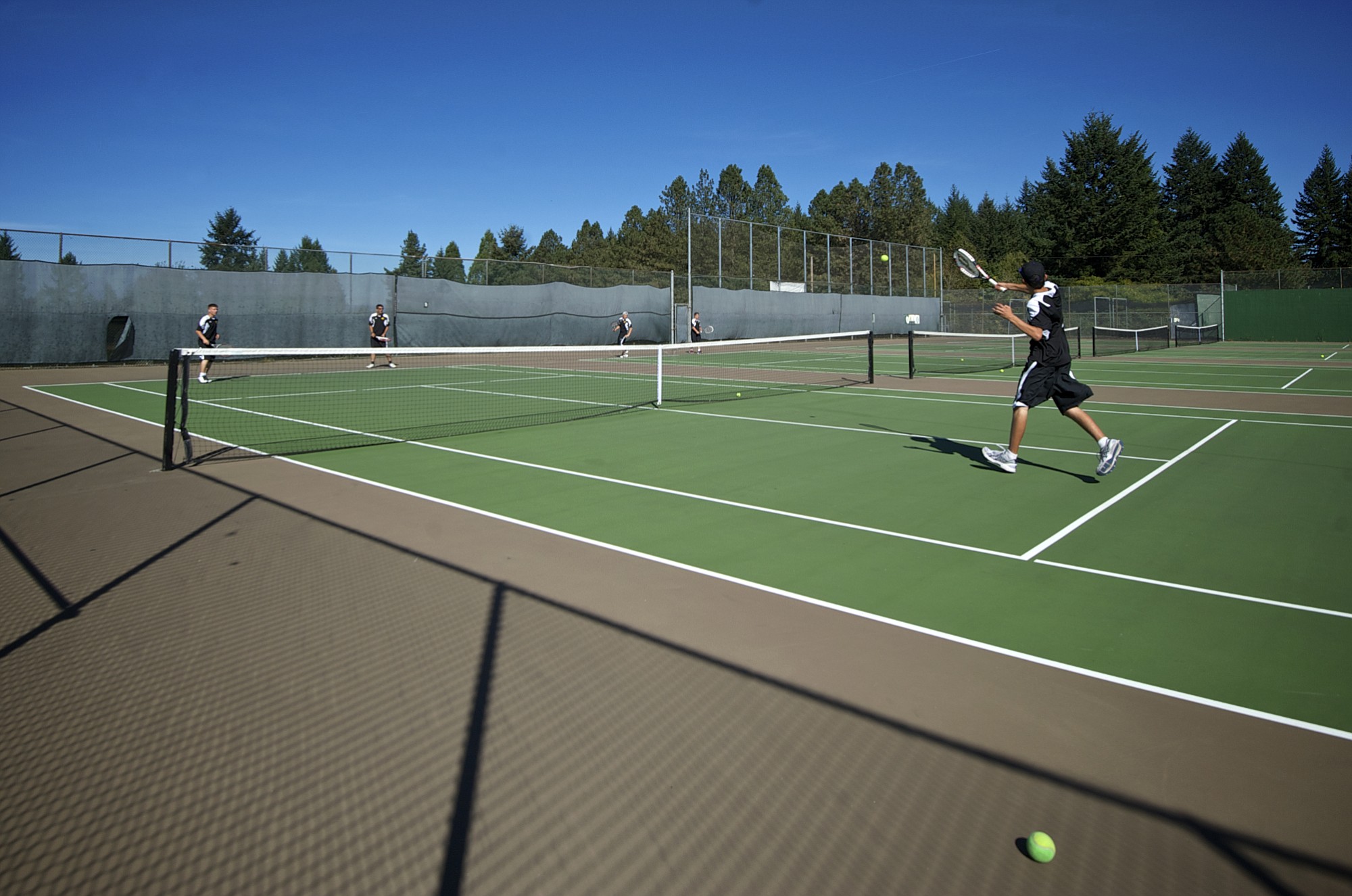 The Evergreen boys tennis team warms up before their match against Skyview on Friday September 19, 2014.