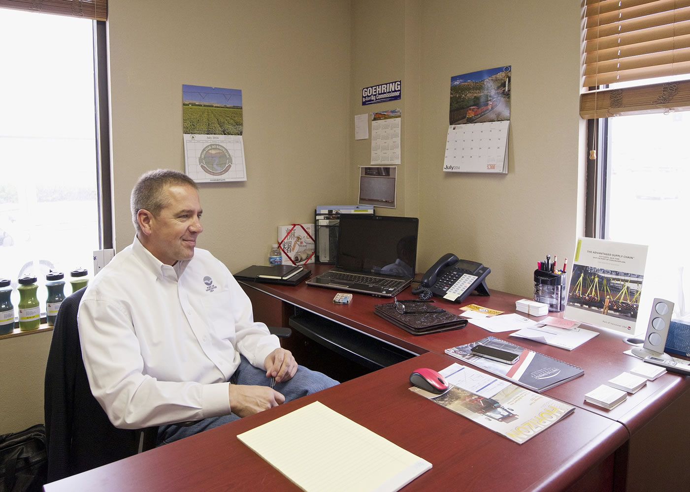 Curtis Shuck, senior sales director for the Port of Vancouver, talks to The Columbian inside the port's Williston, N.D. office on  Aug.