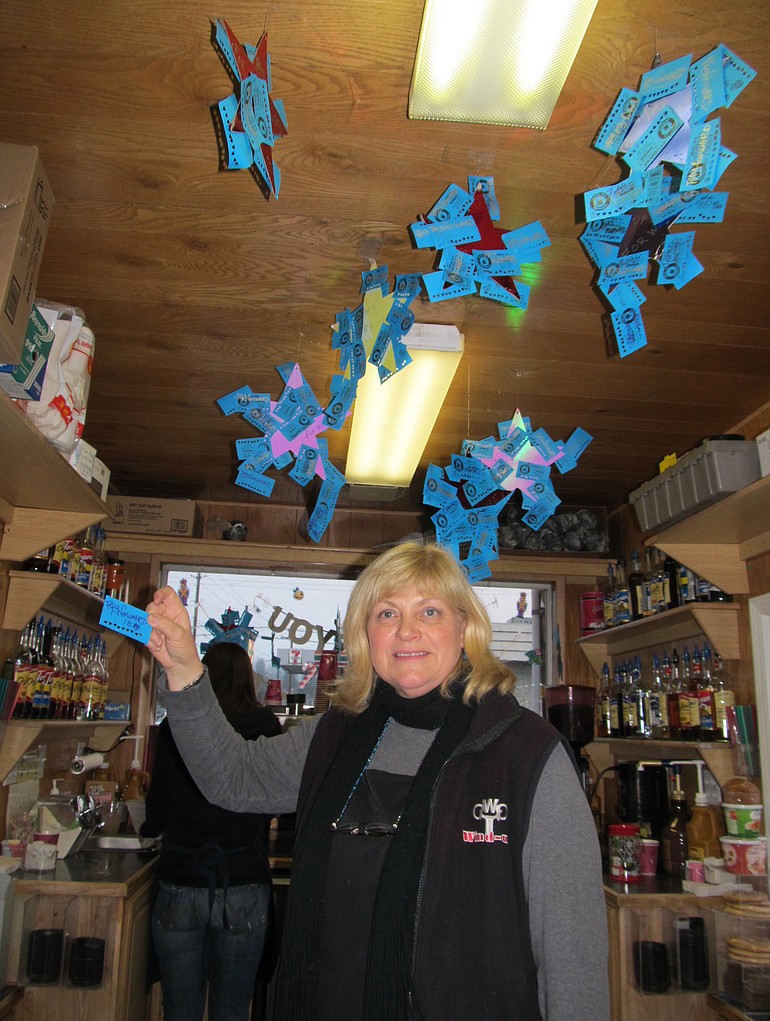 Northeast Hazel Dell: Sherry Bailey hangs punch cards after they have been donated in a &quot;pay-it-forward&quot; program at Mrs.