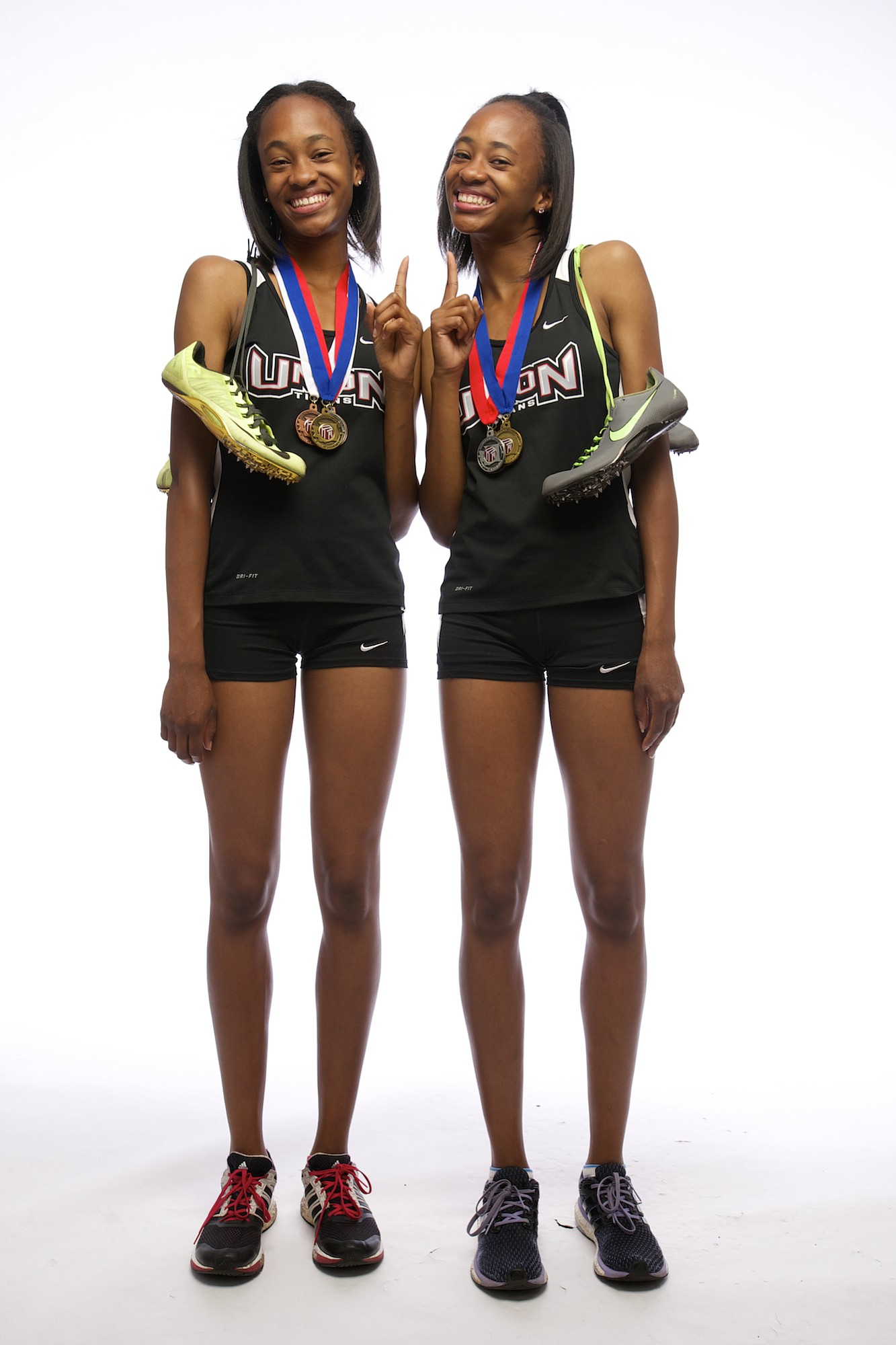 All-Region girls track athletes of the year, Jai'lyn, left, and Dai'lyn Merriweather of Union, shown, Wednesday, June 10, 2015.