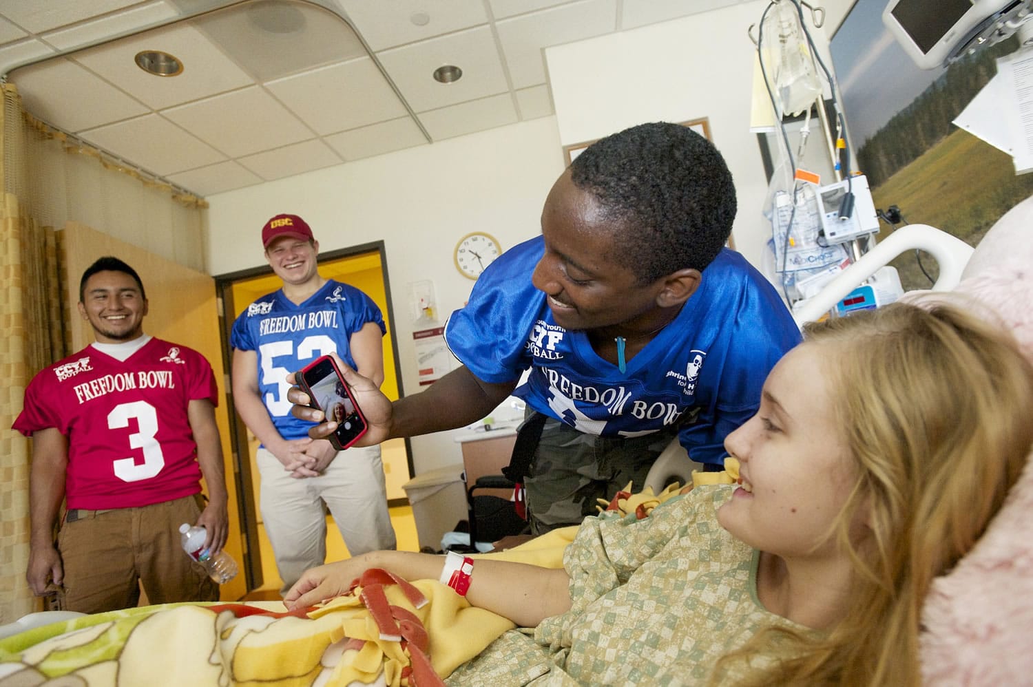 E'Lon Mack, from Heritage, shoots a selfie with Shriners patient Skyla deLint, 17, from Cove, OR, during a tour of the hospital, Wednesday, July 9, 2014.