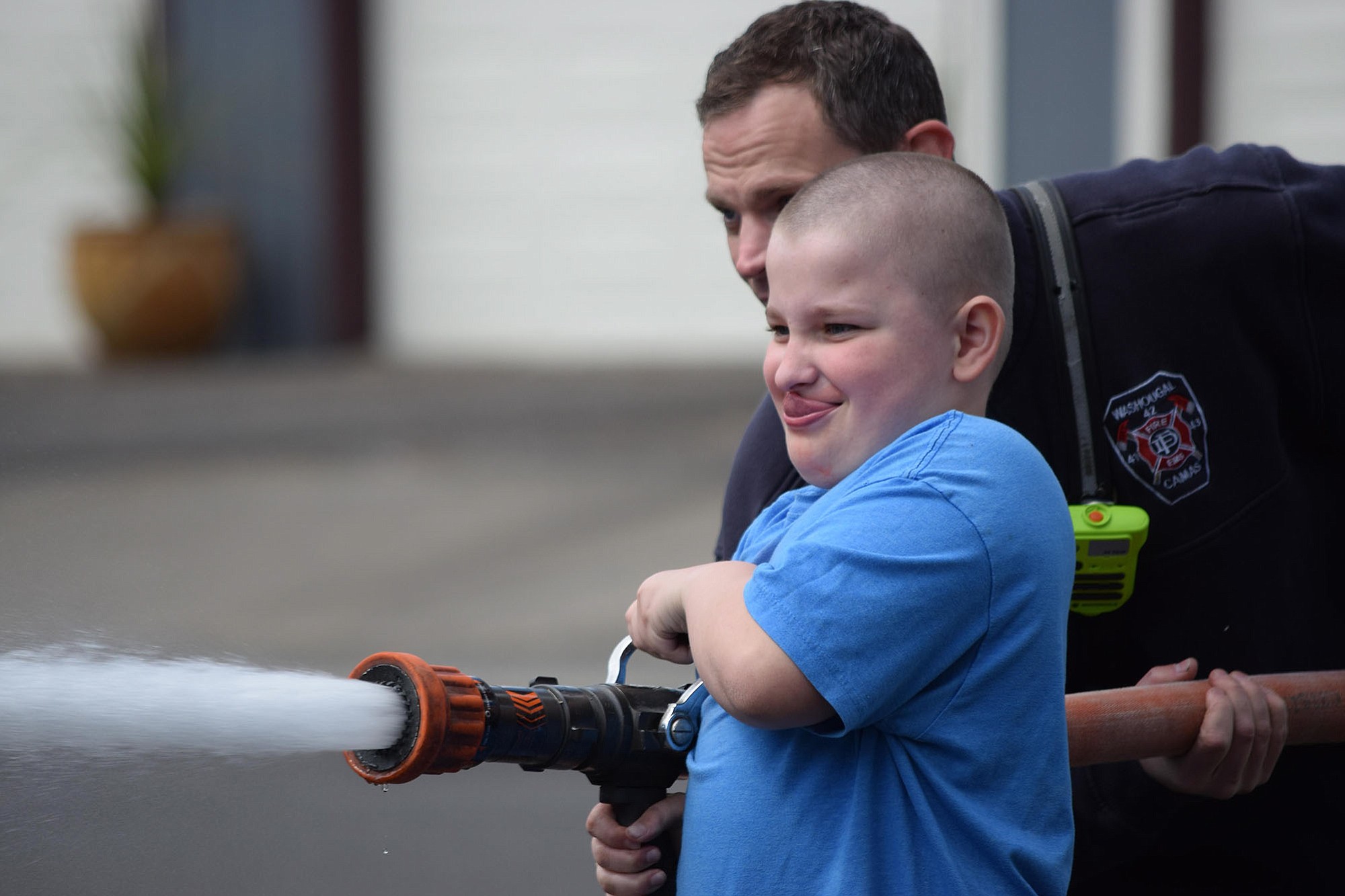 Washougal: Gaerett Bailey learned to use a fire hose from a local firefighter as part of Hathaway Elementary School's Young Men In Action program.