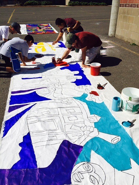 Hazel Dell: Sarah J Anderson students work on a 45-foot mural to be placed in the entrance way of the school, honoring their upcoming journey to college.