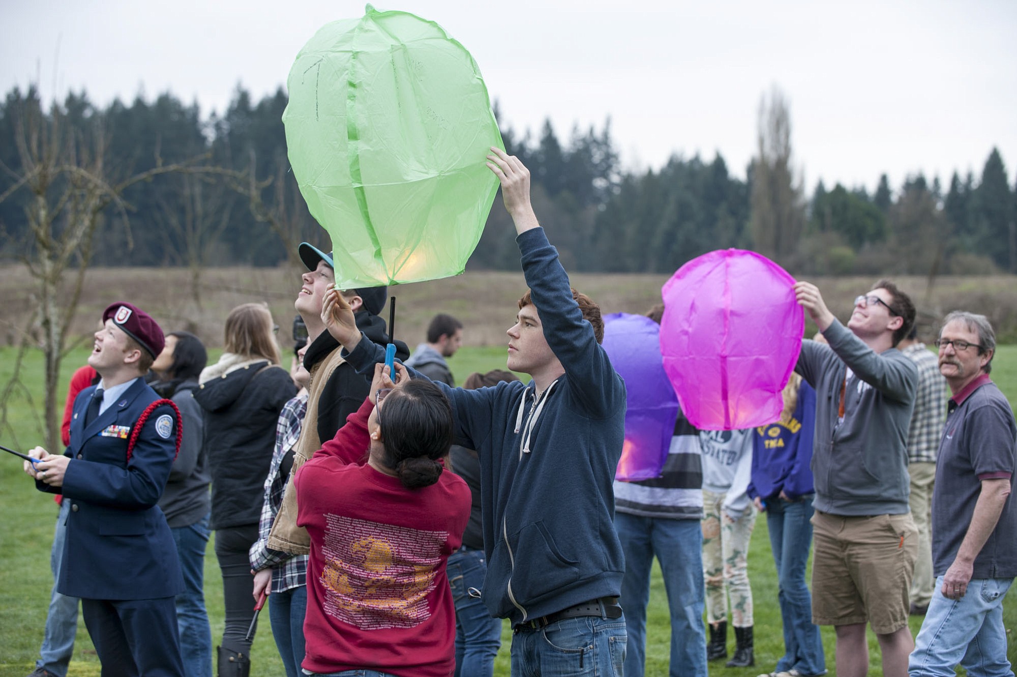Student Ryan Maloney releases a paper lantern at the Center for Agriculture, Science and Environmental Education on Wednesday.