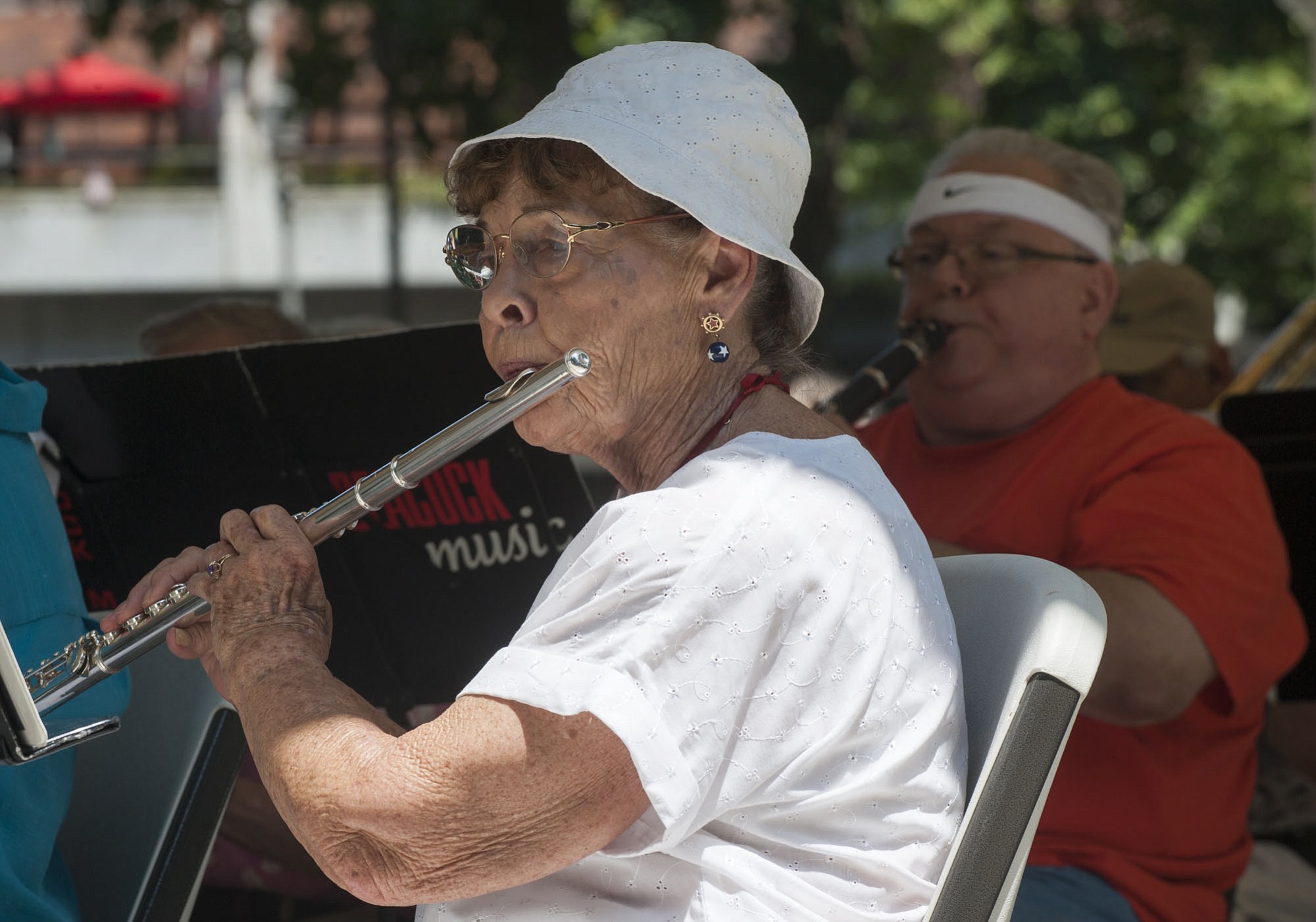 Flautist Phyllis Jeane Spears performs with the Vancouver Pops Orchestra during a free performance in Esther Short Park on Wednesday at noon. It was the beginning of the city's series of free lunchtime summer concerts, which run through Aug.