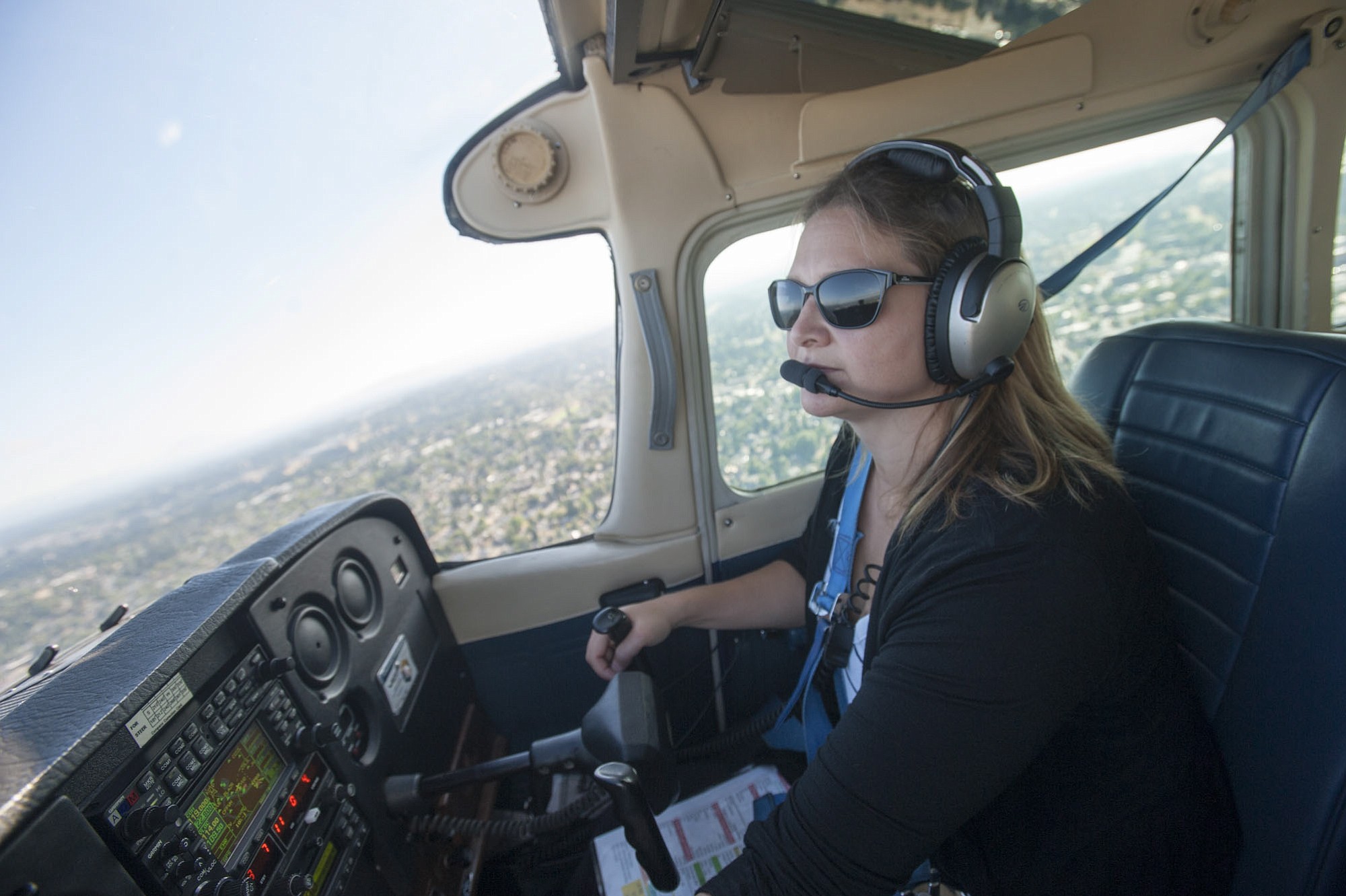 Pilot Theresa Nelson flies a Cessna 172 over Clark County on July 28. Nelson is the only woman out of 10 flight instructors at Aero Maintenance Flight Center at Pearson Field.