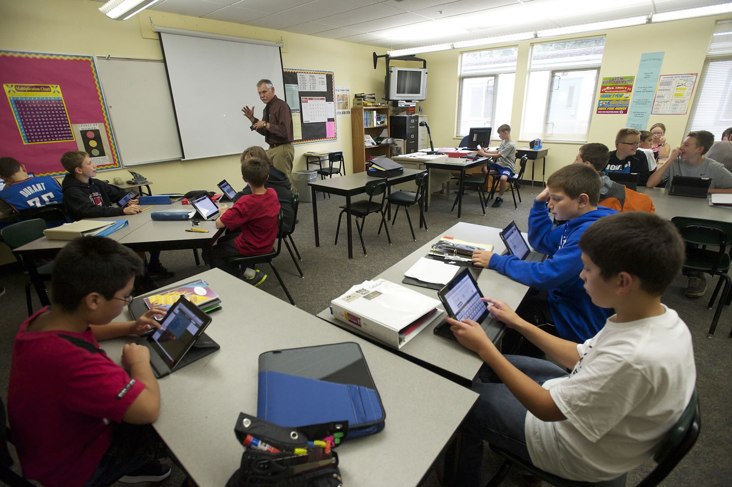 Students in Mike Hollins' math class at La Center Middle School use iPads for daily excercises in September of 2013.