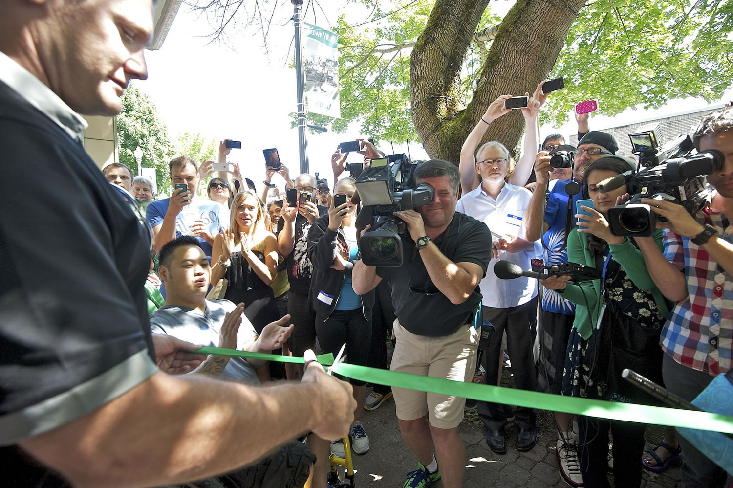 Vancouver Mayor Tim Leavitt cuts the ribbon at Main Street Marijuana on Wednesday.