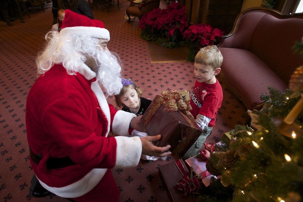 Kids meet with Santa at the Marshall House.
